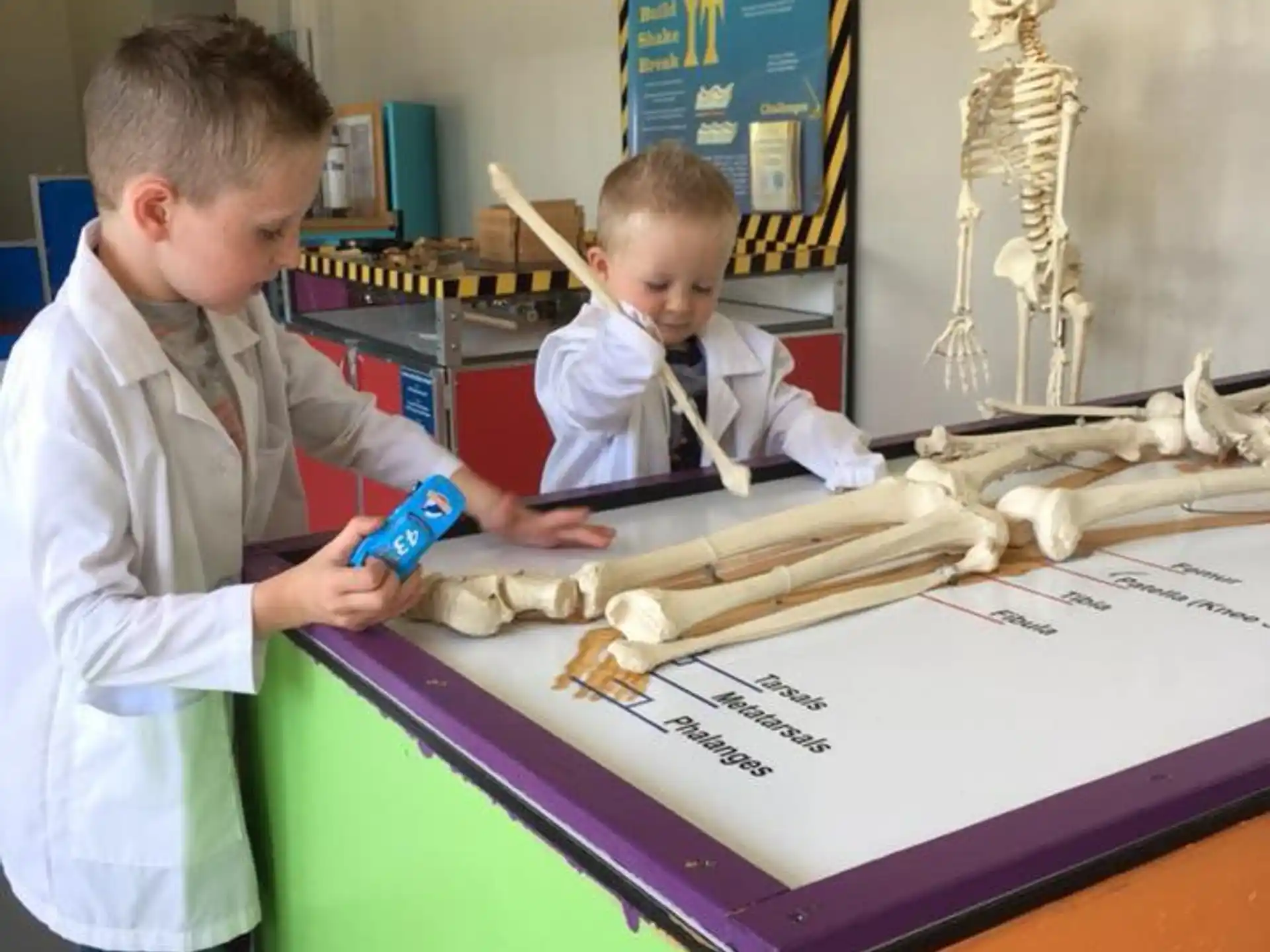 a boy and a boy playing with a toy