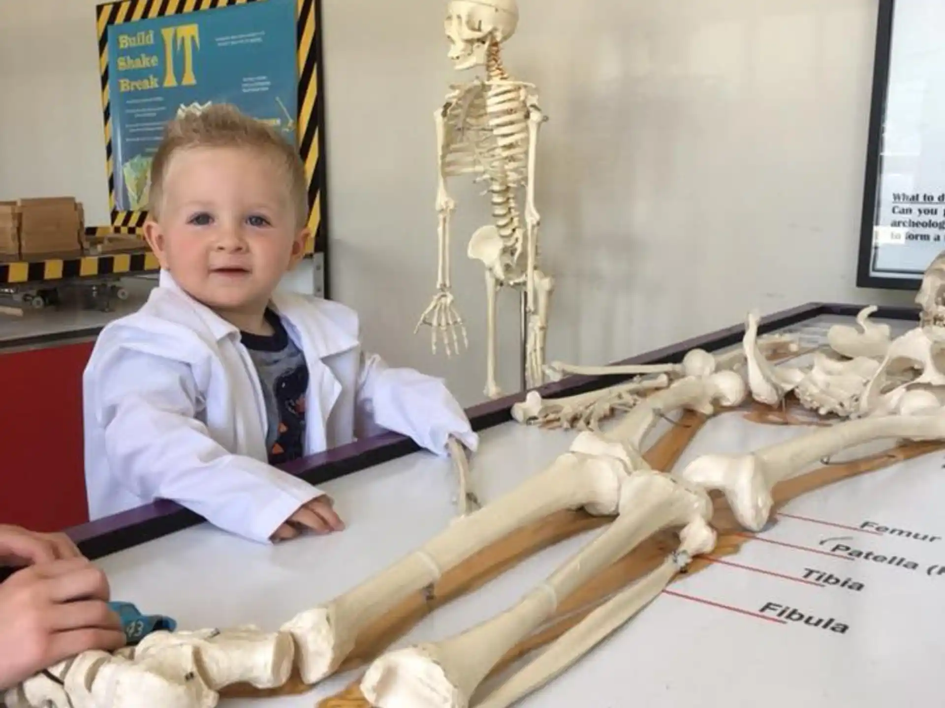 a child sitting at a desk