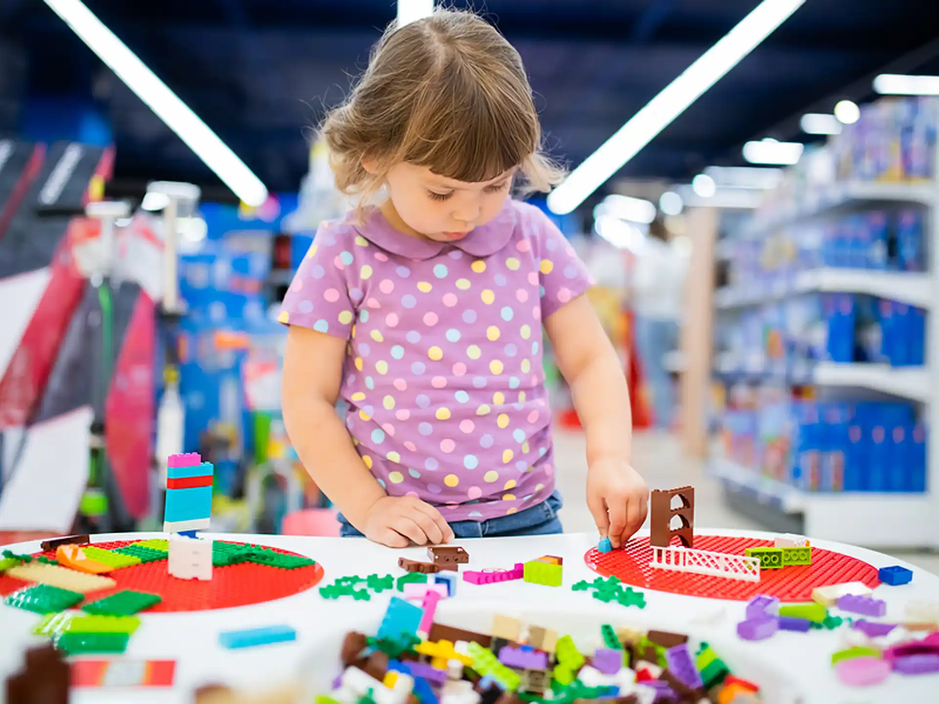 a little girl playing with a toy