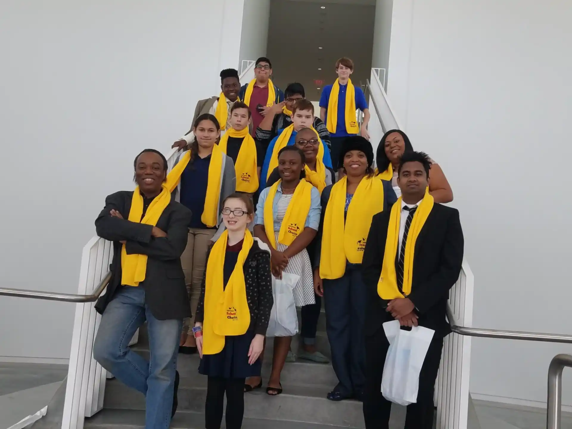 a group of people wearing yellow shirts