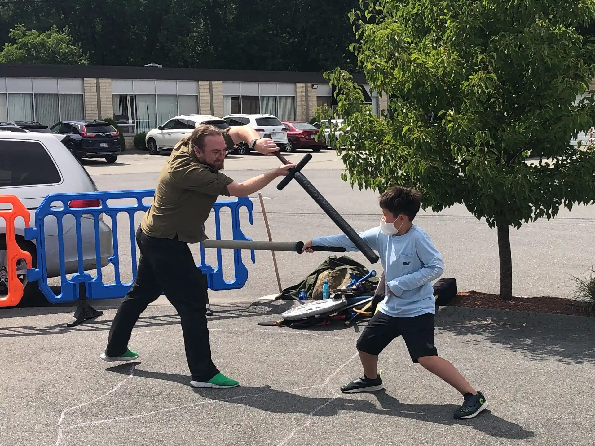 a person pushing a child on a scooter