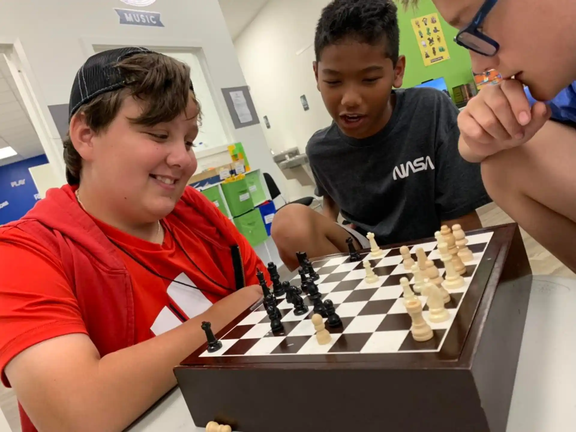a group of people playing chess