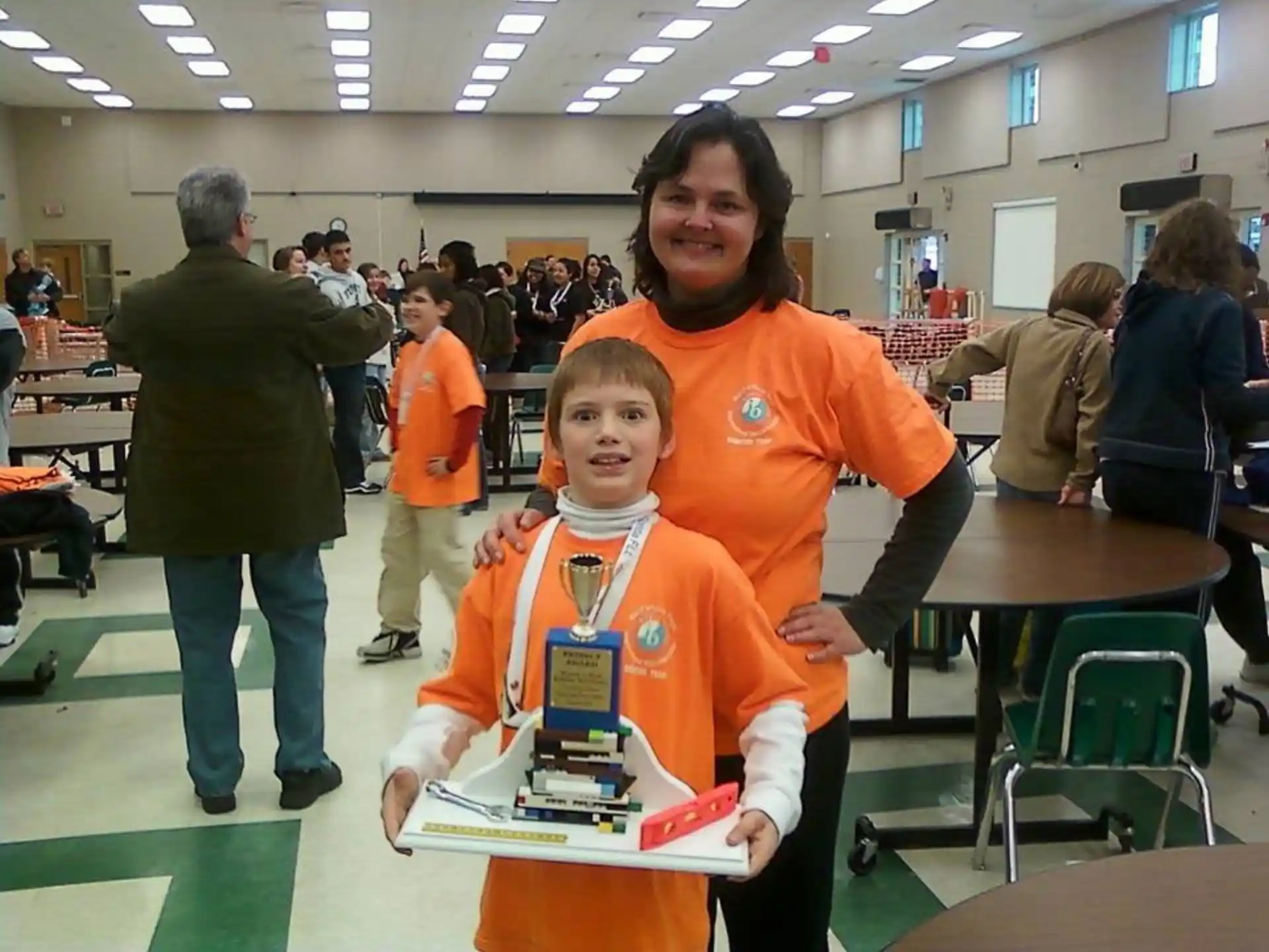 a person and a boy in orange jumpsuits