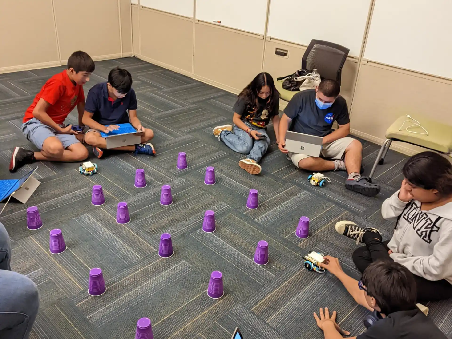 a group of people sitting on the floor playing a game