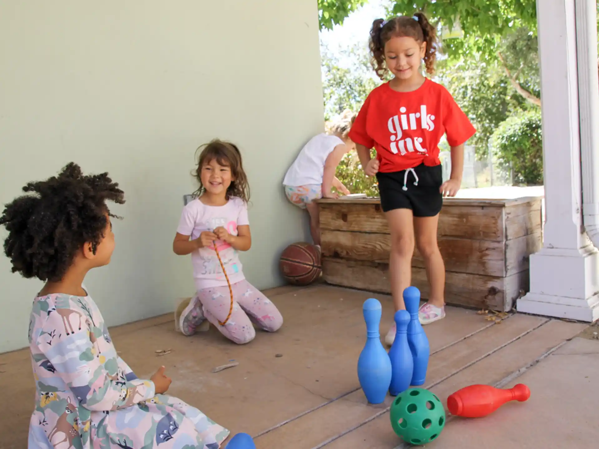 a group of children playing with toys
