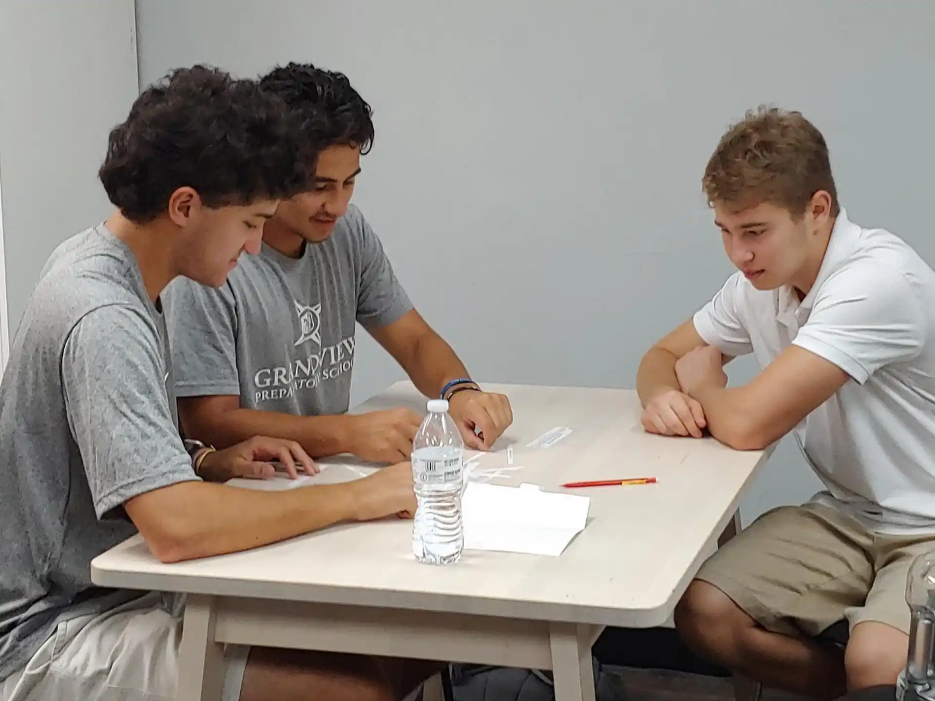 a group of men sitting at a table