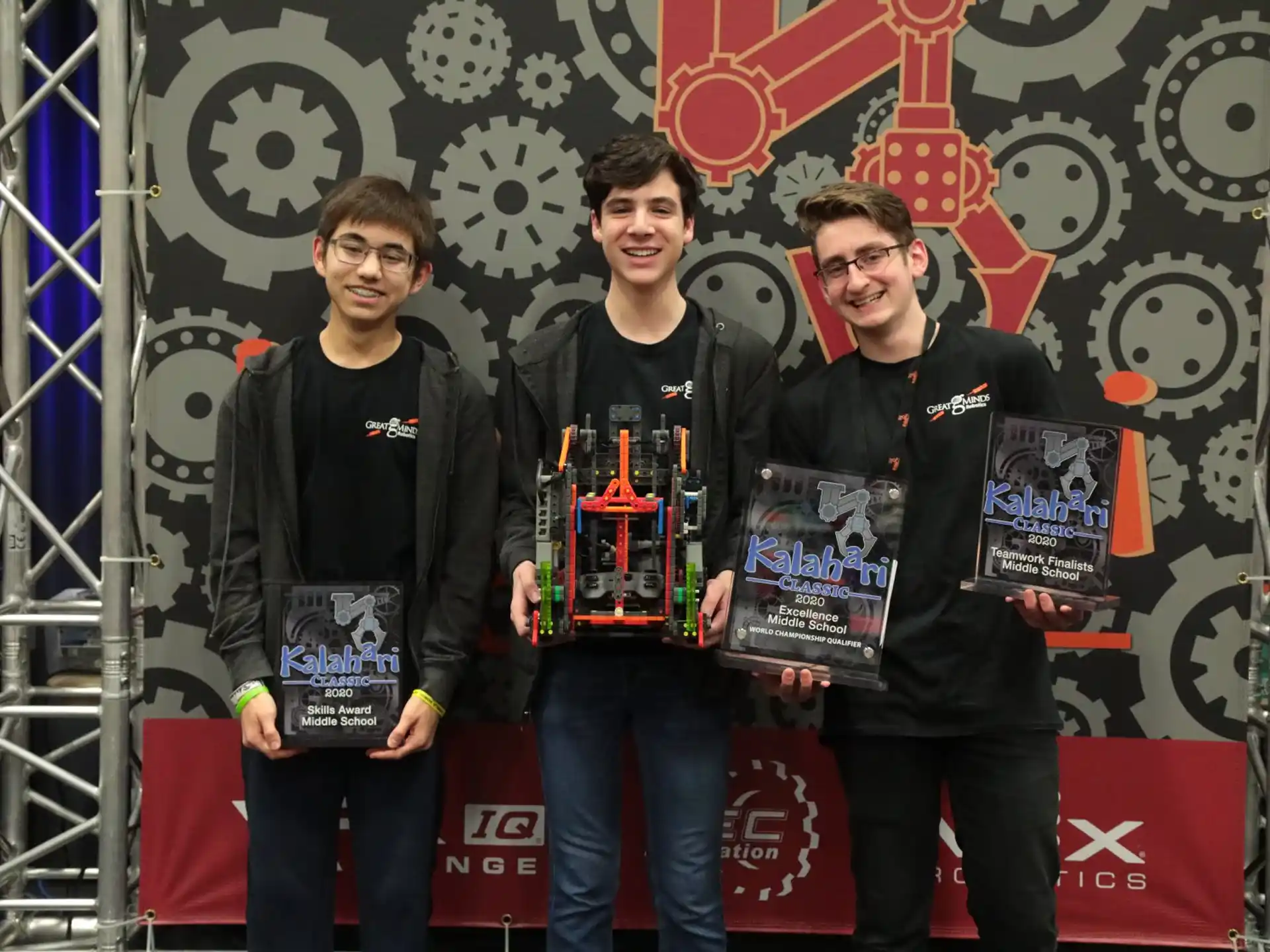 a group of men holding awards