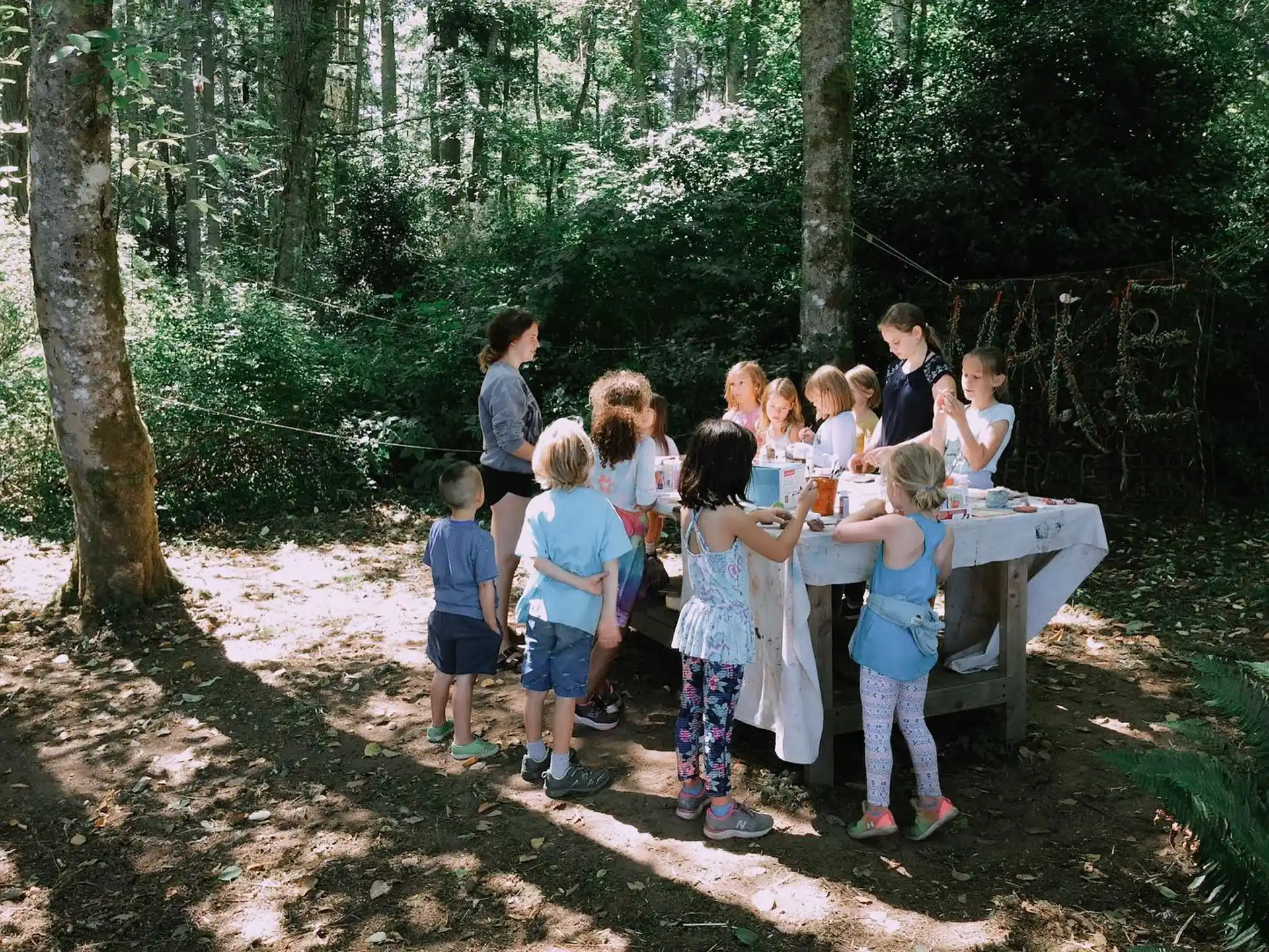 a group of children around a table