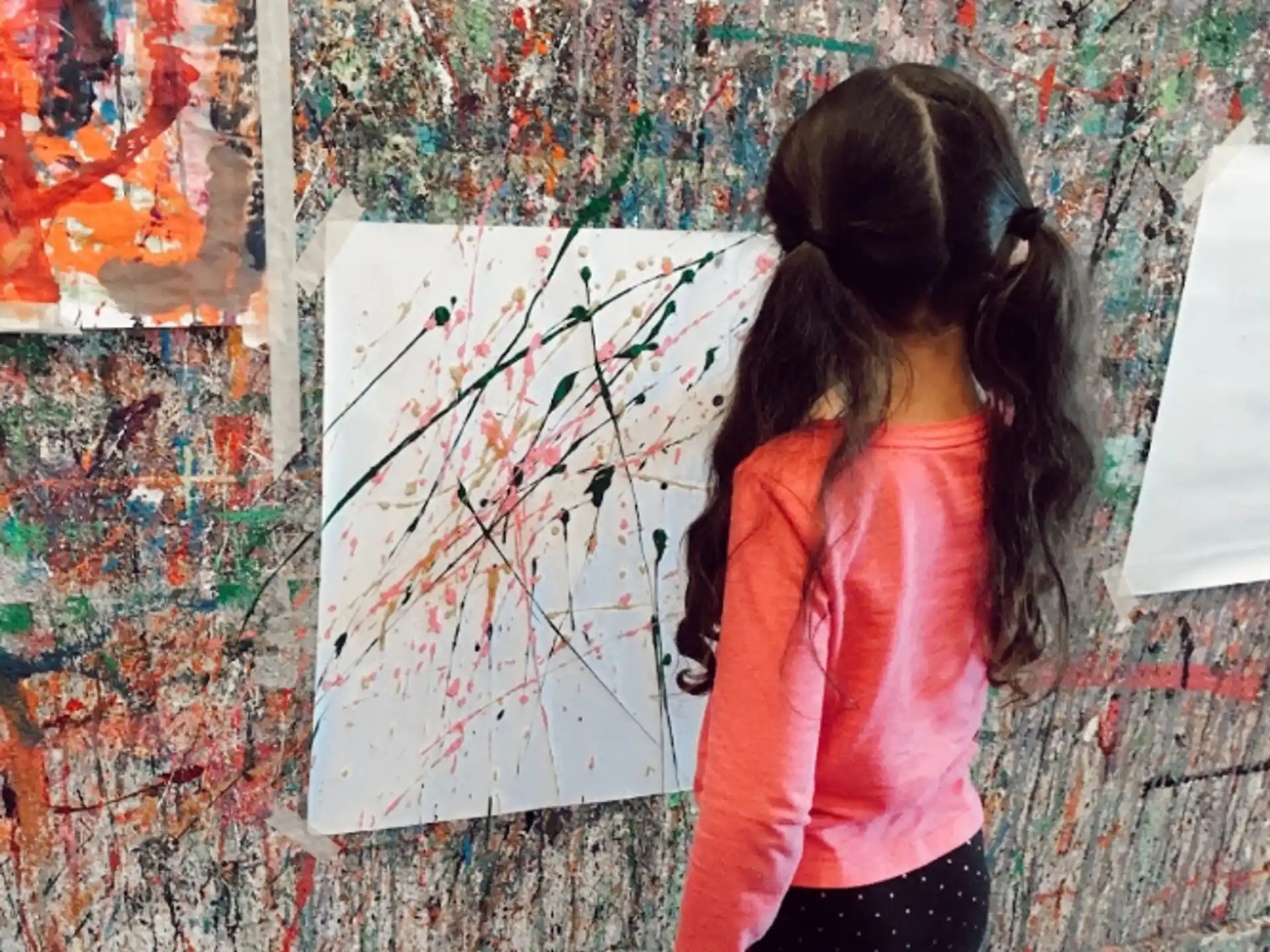 a person painting on a wall
