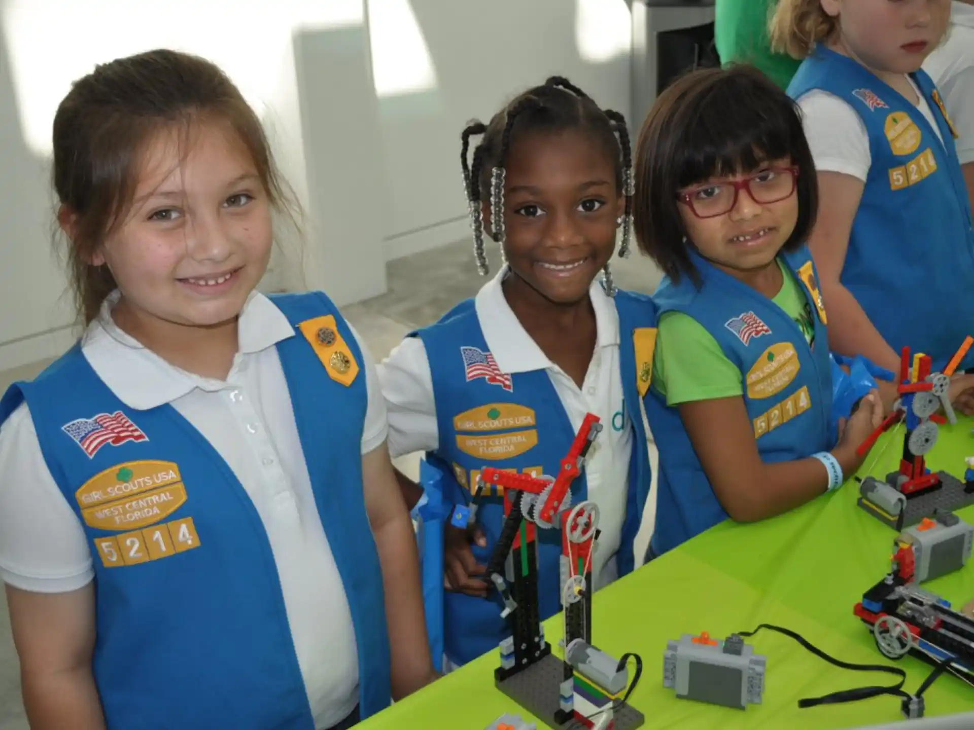 a group of young girls in matching t-shirts