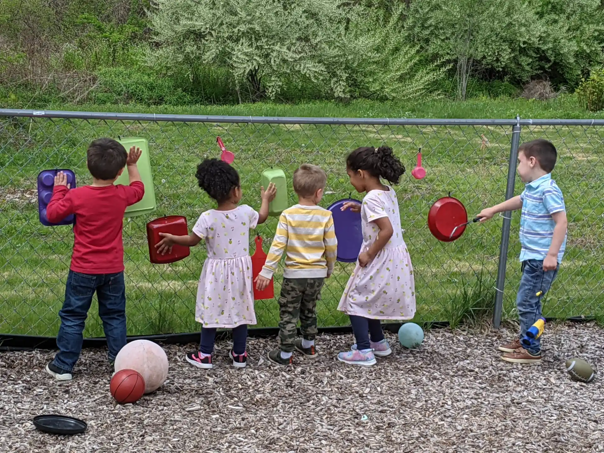 a group of children playing with balls