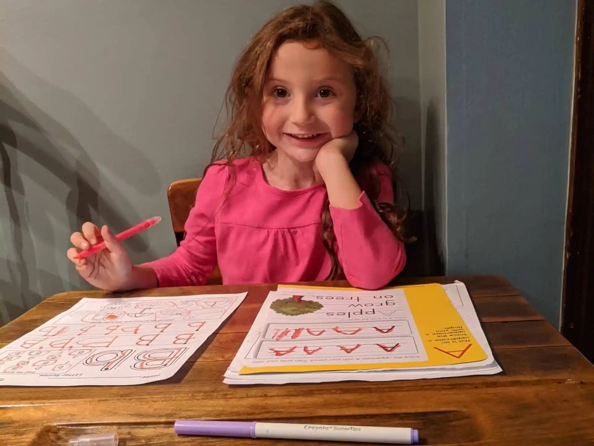 a girl sitting at a table