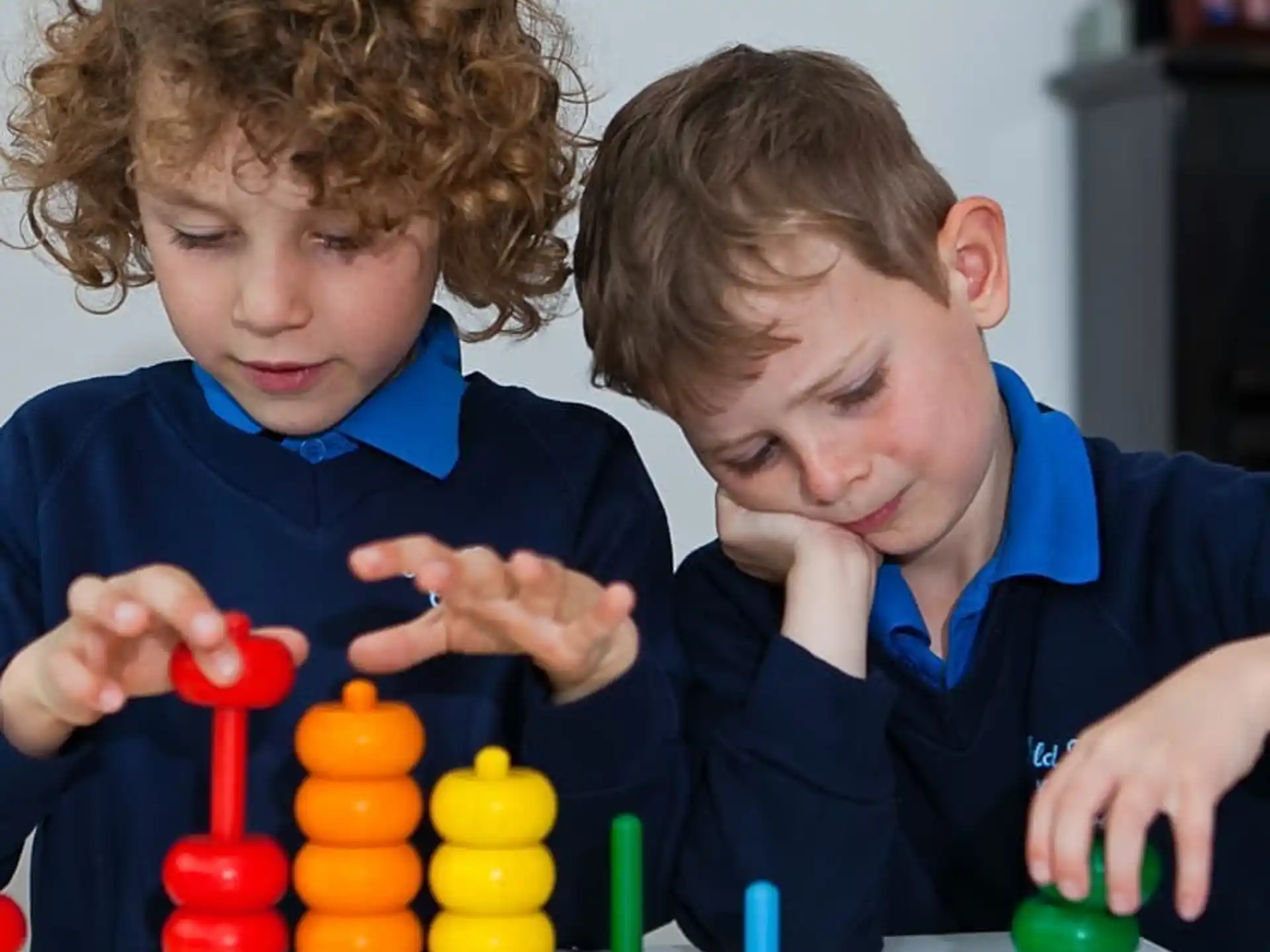 a person and a child playing with toys
