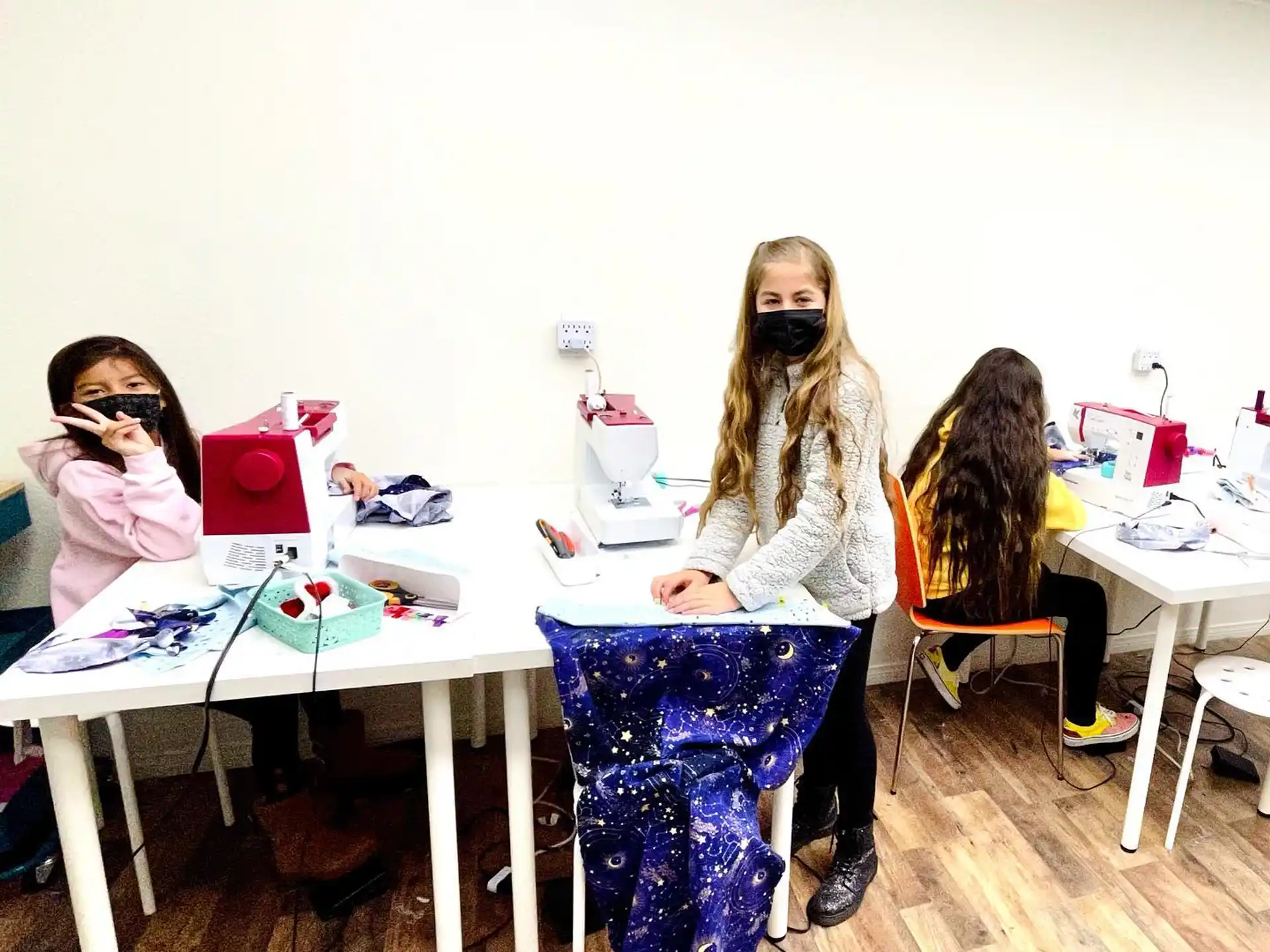 a group of women sitting at a table