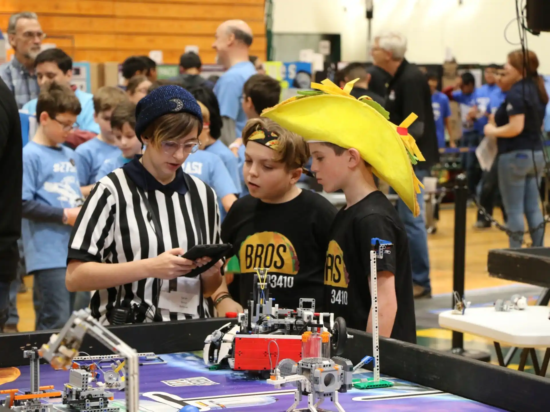 a group of people looking at a device