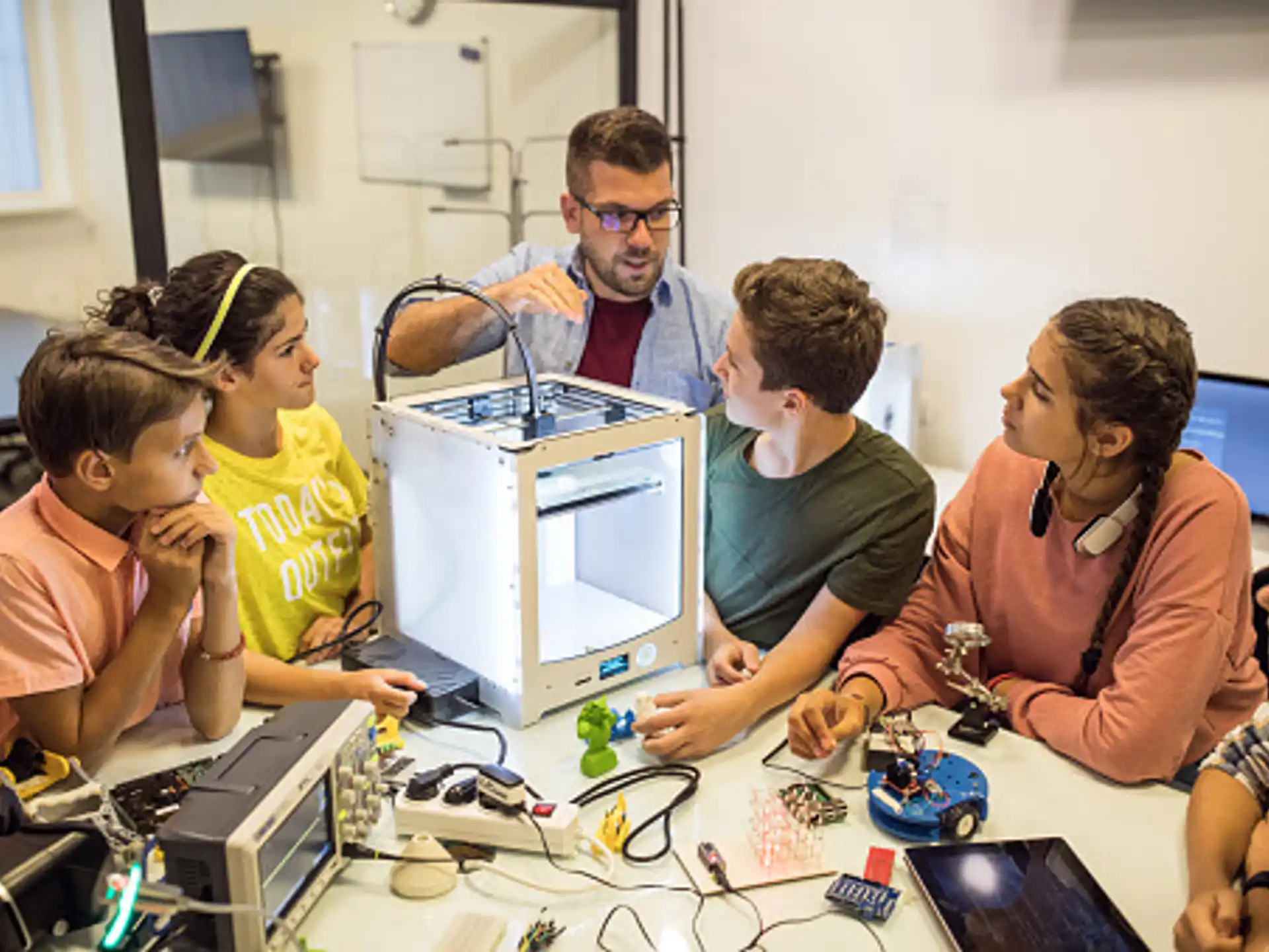 a group of people looking at a computer screen