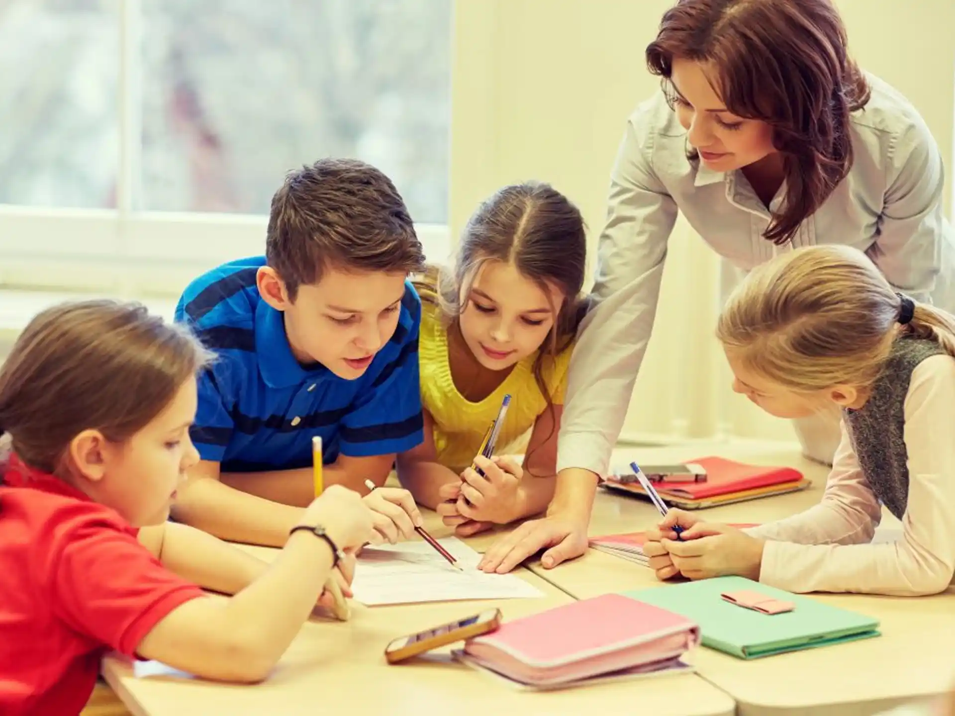 a person and several children studying