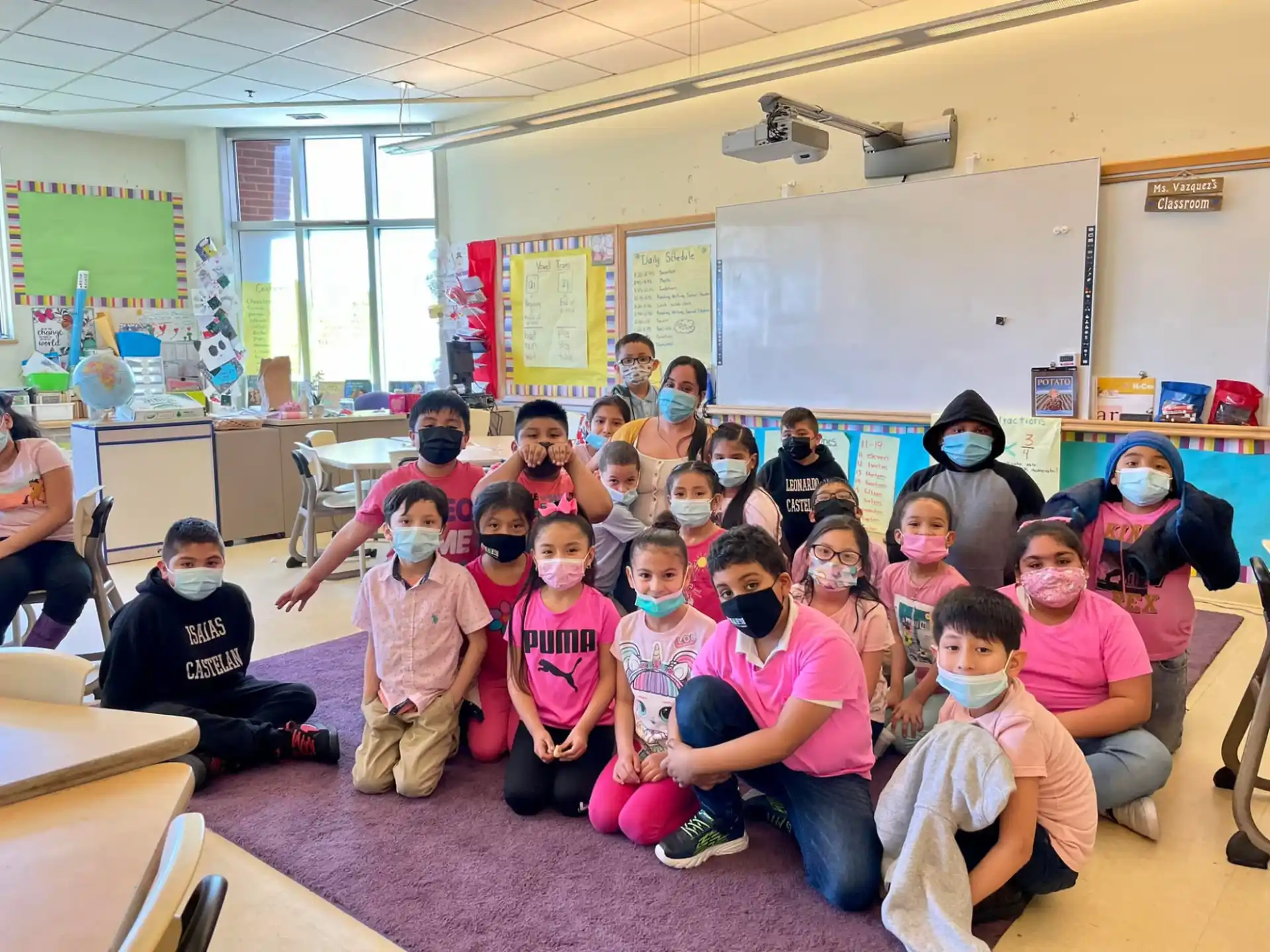 a group of children sitting in a classroom
