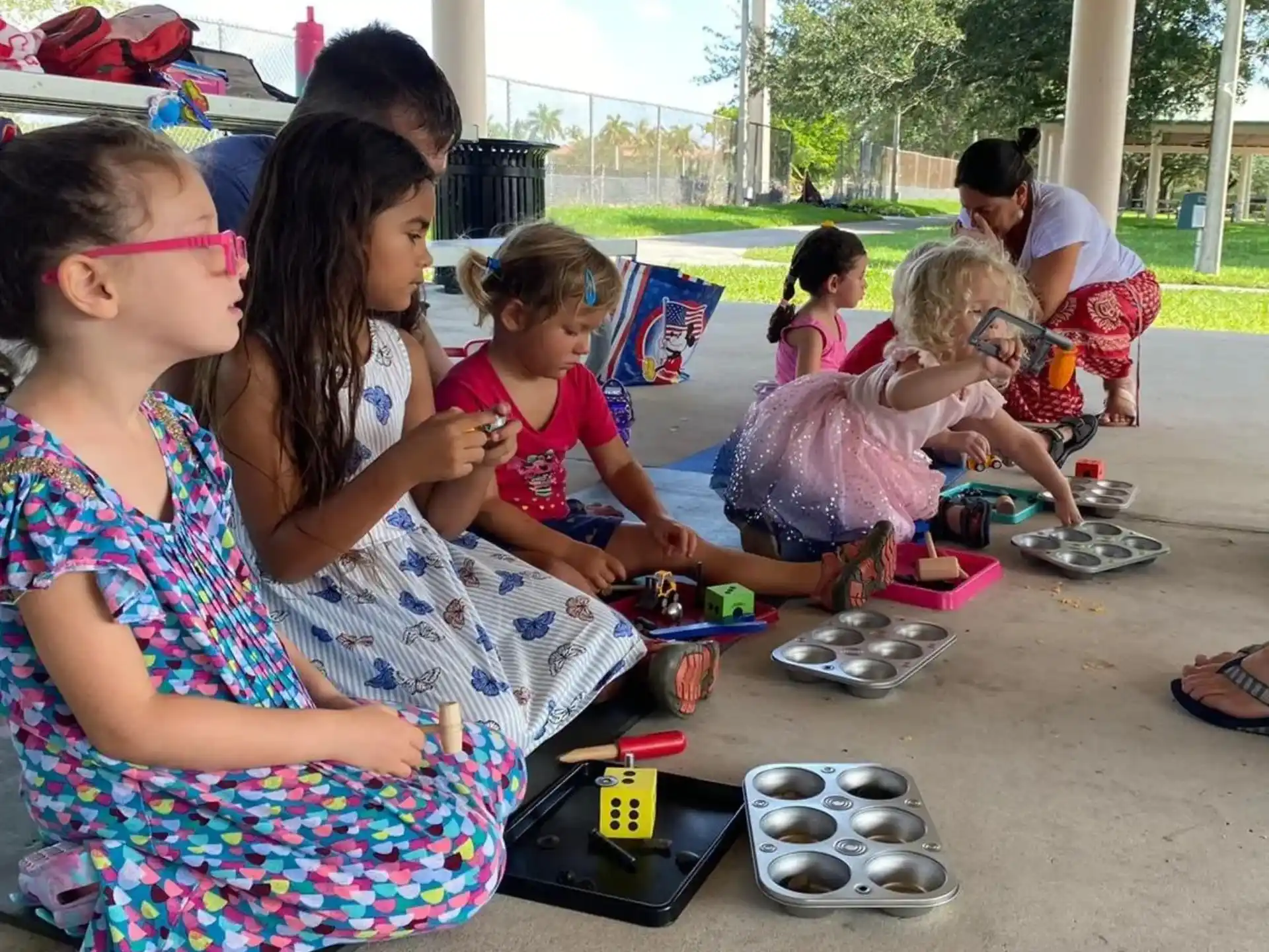 a group of children playing with toys
