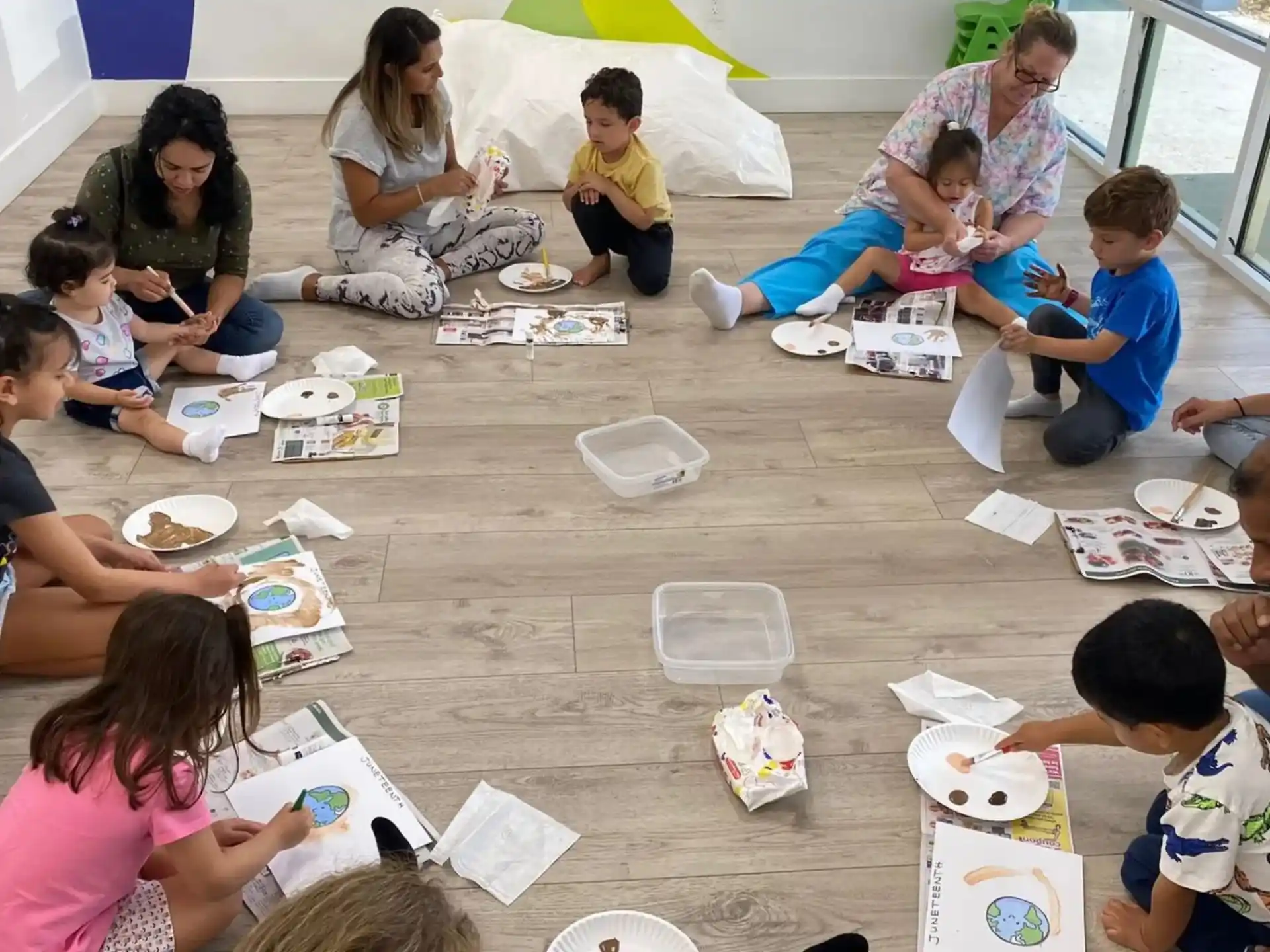 a group of people sitting on the floor eating food