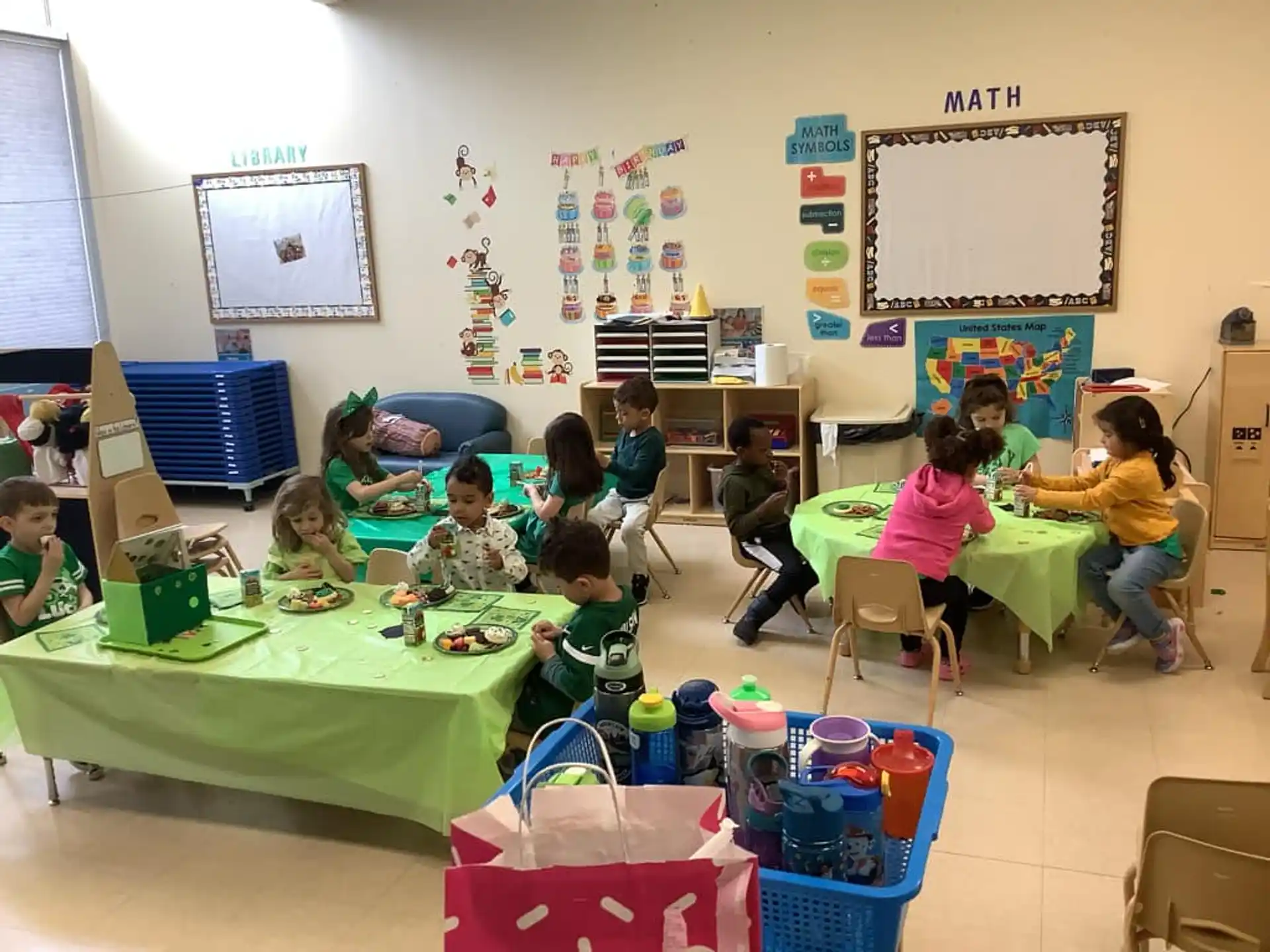 a group of children sitting at desks in a classroom
