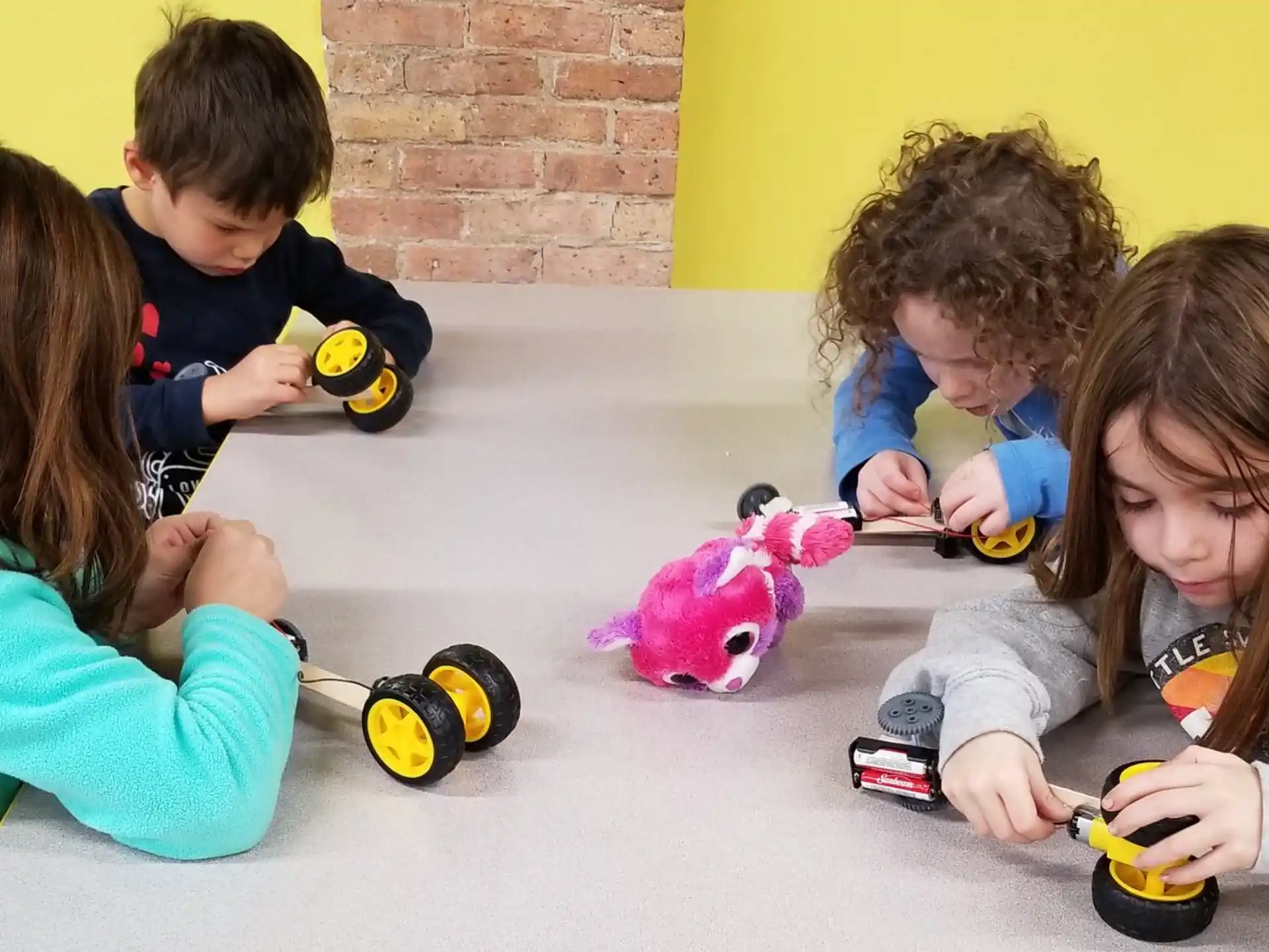 a group of children playing with toys