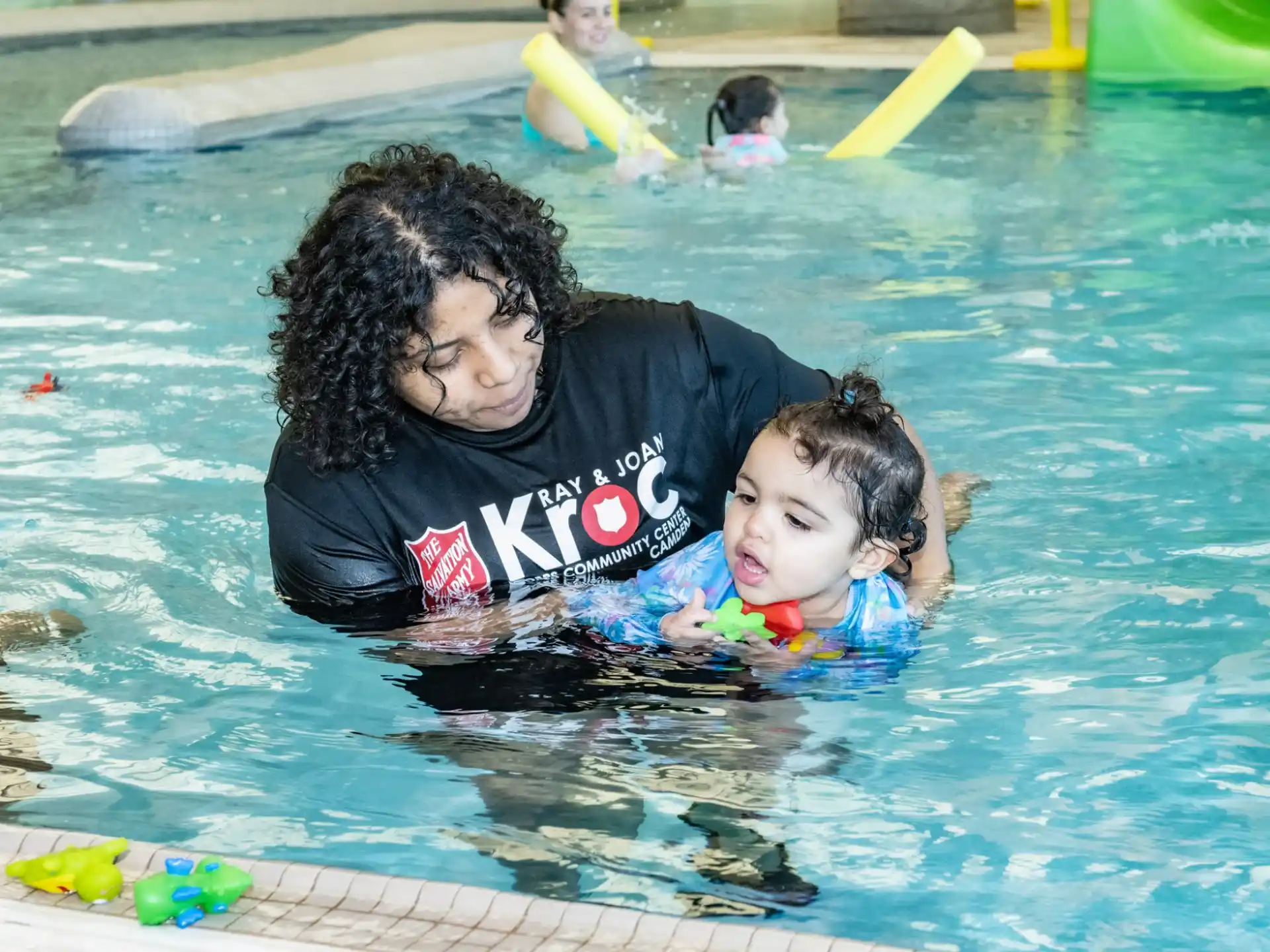 a person and a child in a pool