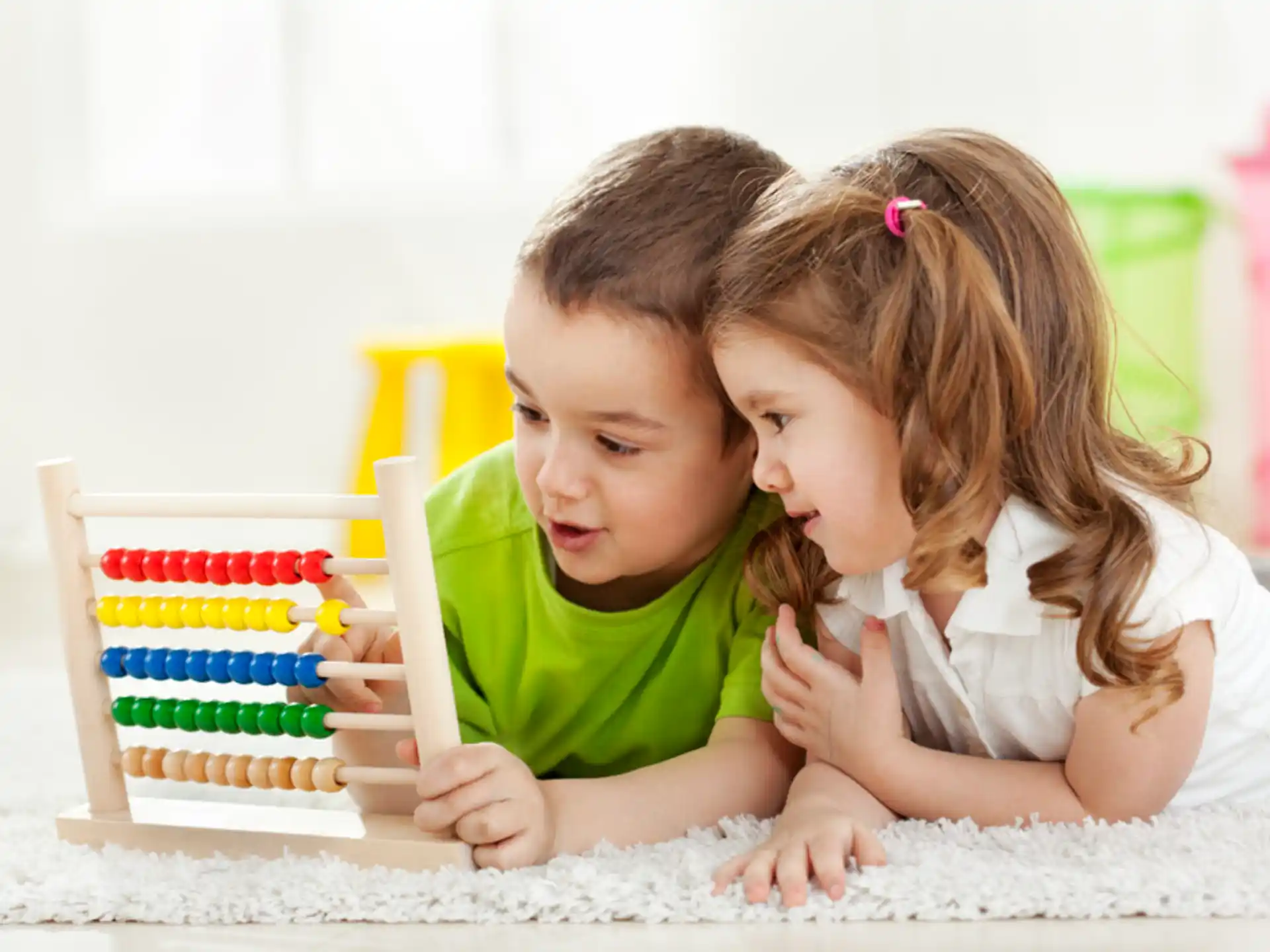 a couple of children playing with a toy