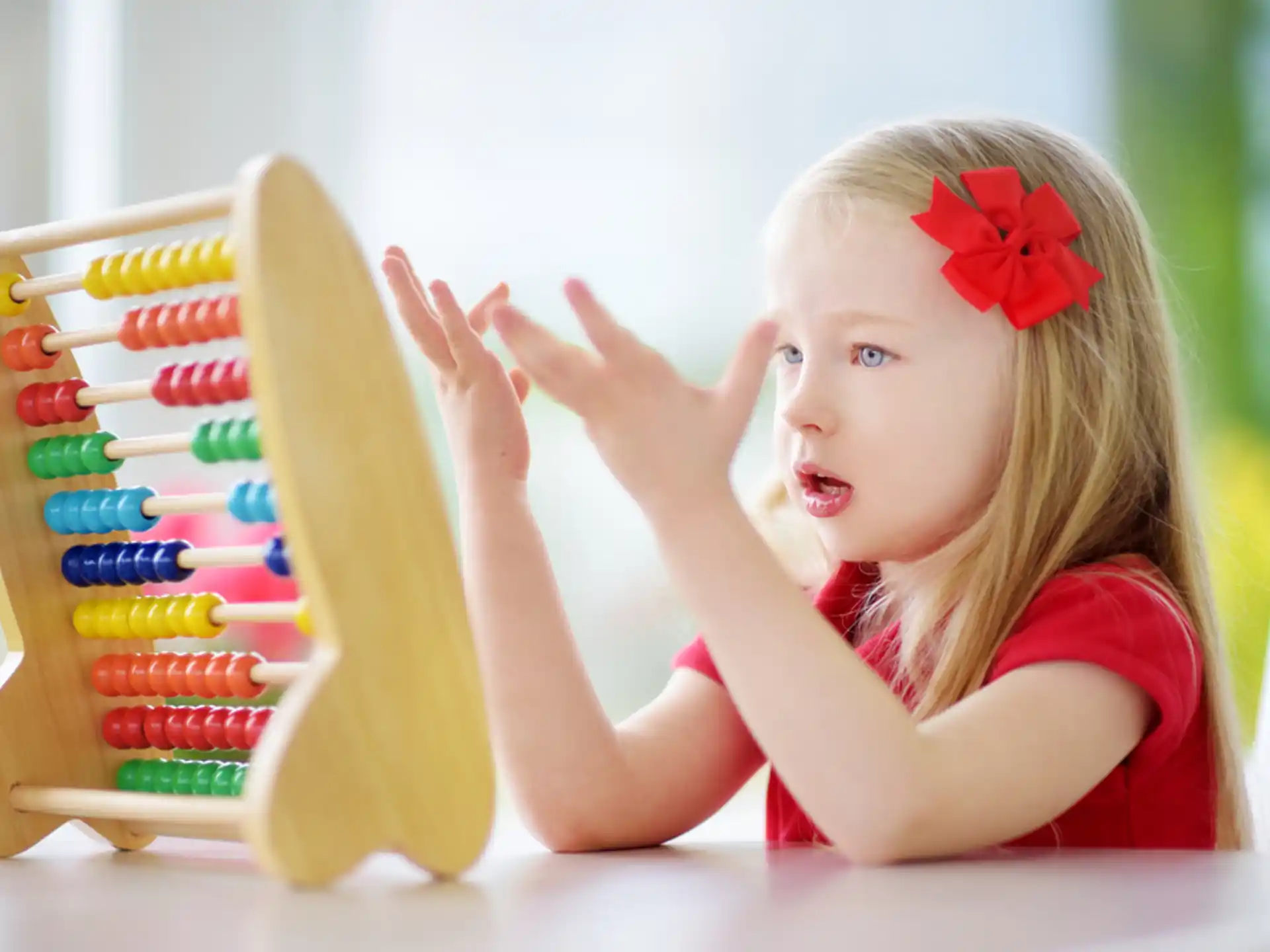 a girl with her hands on a box of cookies
