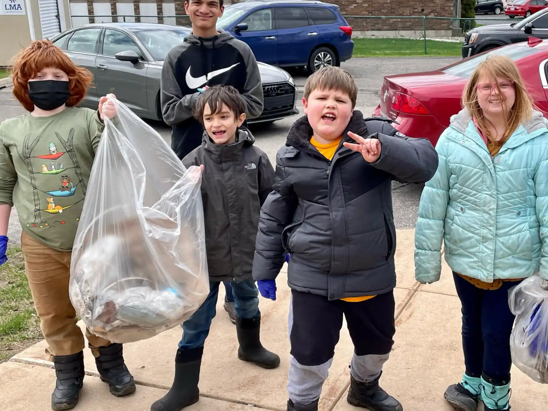 a group of people holding bags