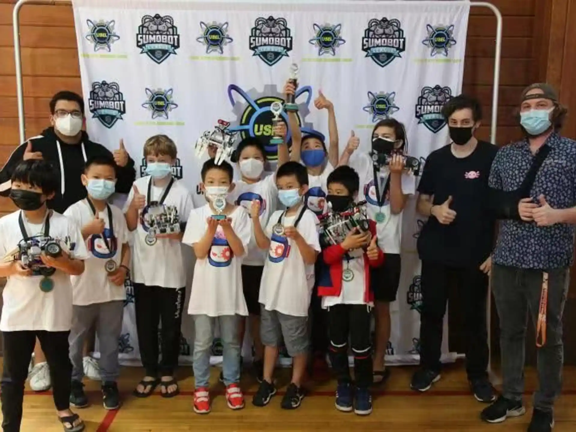 a group of people wearing masks