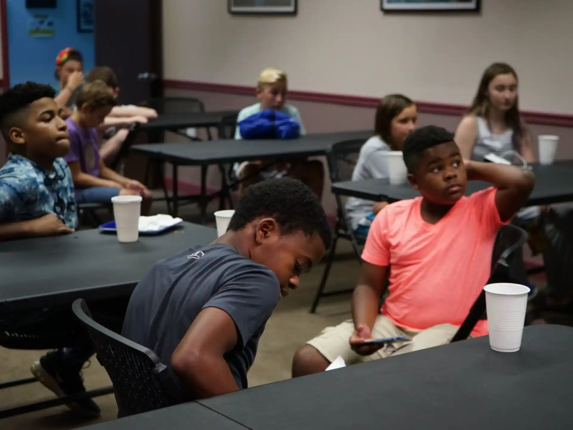 a group of people sitting at tables