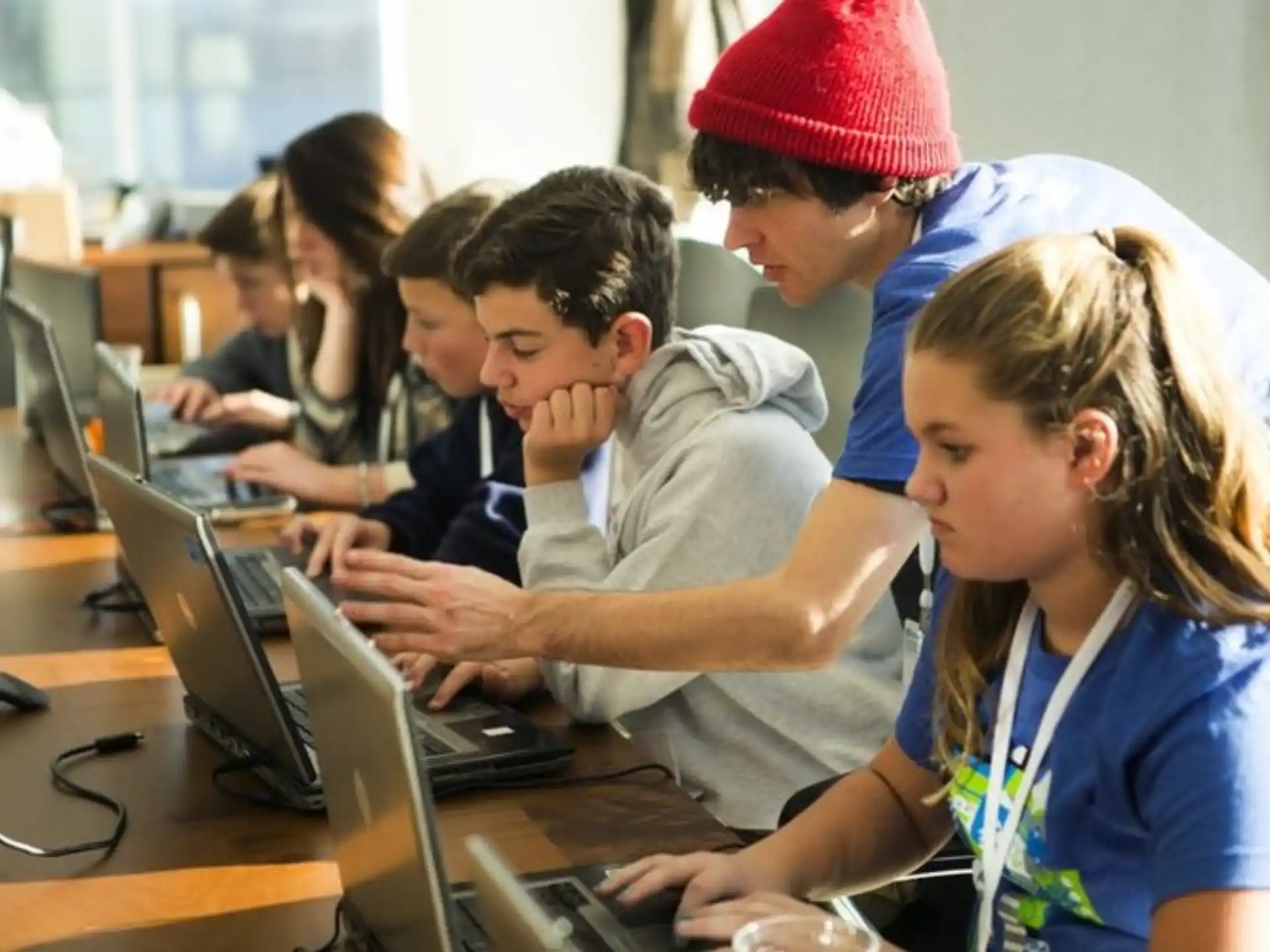 a group of people working on computers