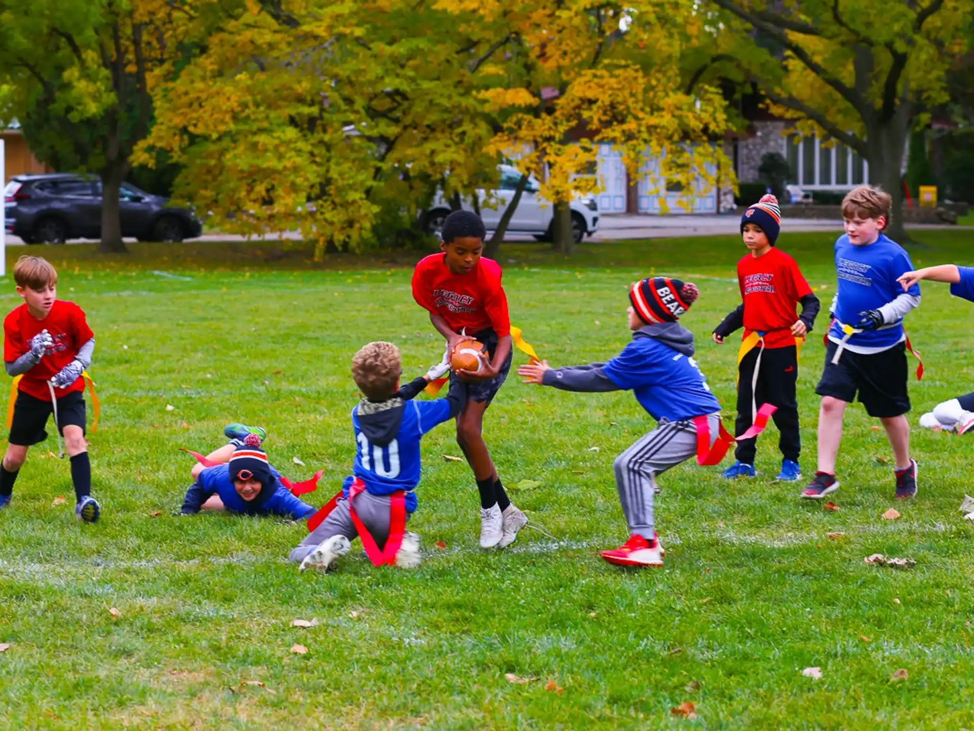 a group of kids playing football