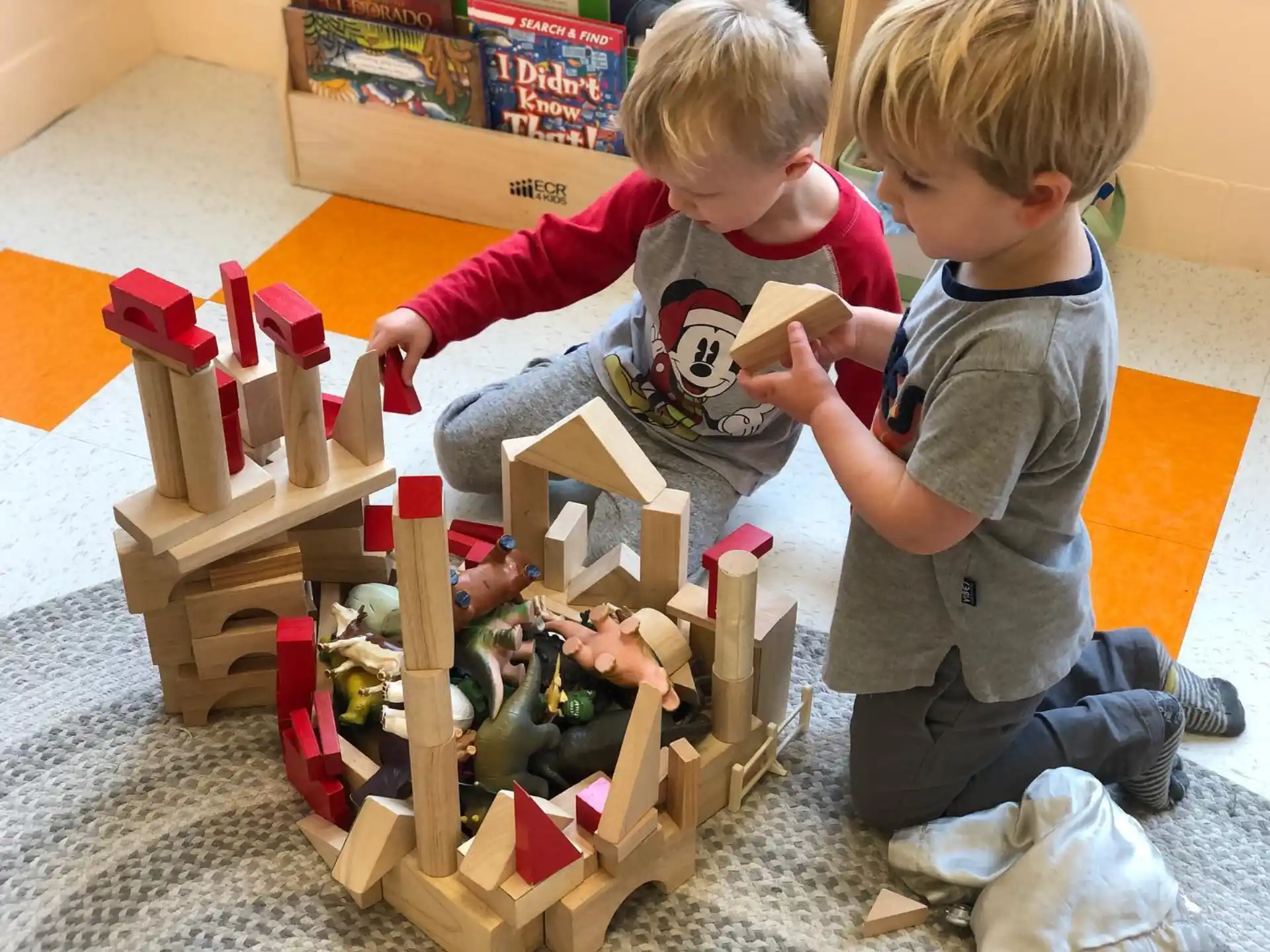 a couple of kids playing with toys