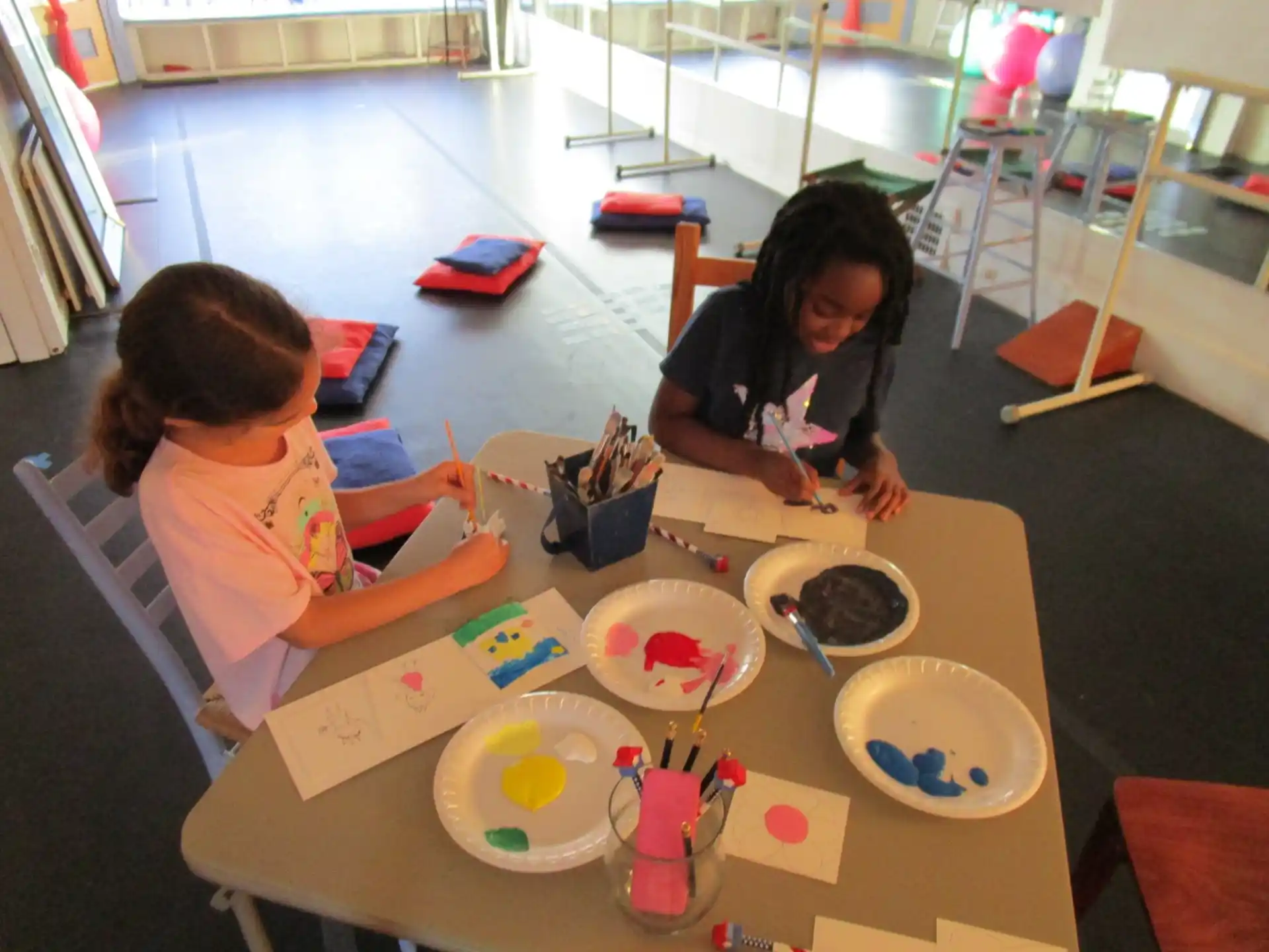 a couple of girls painting