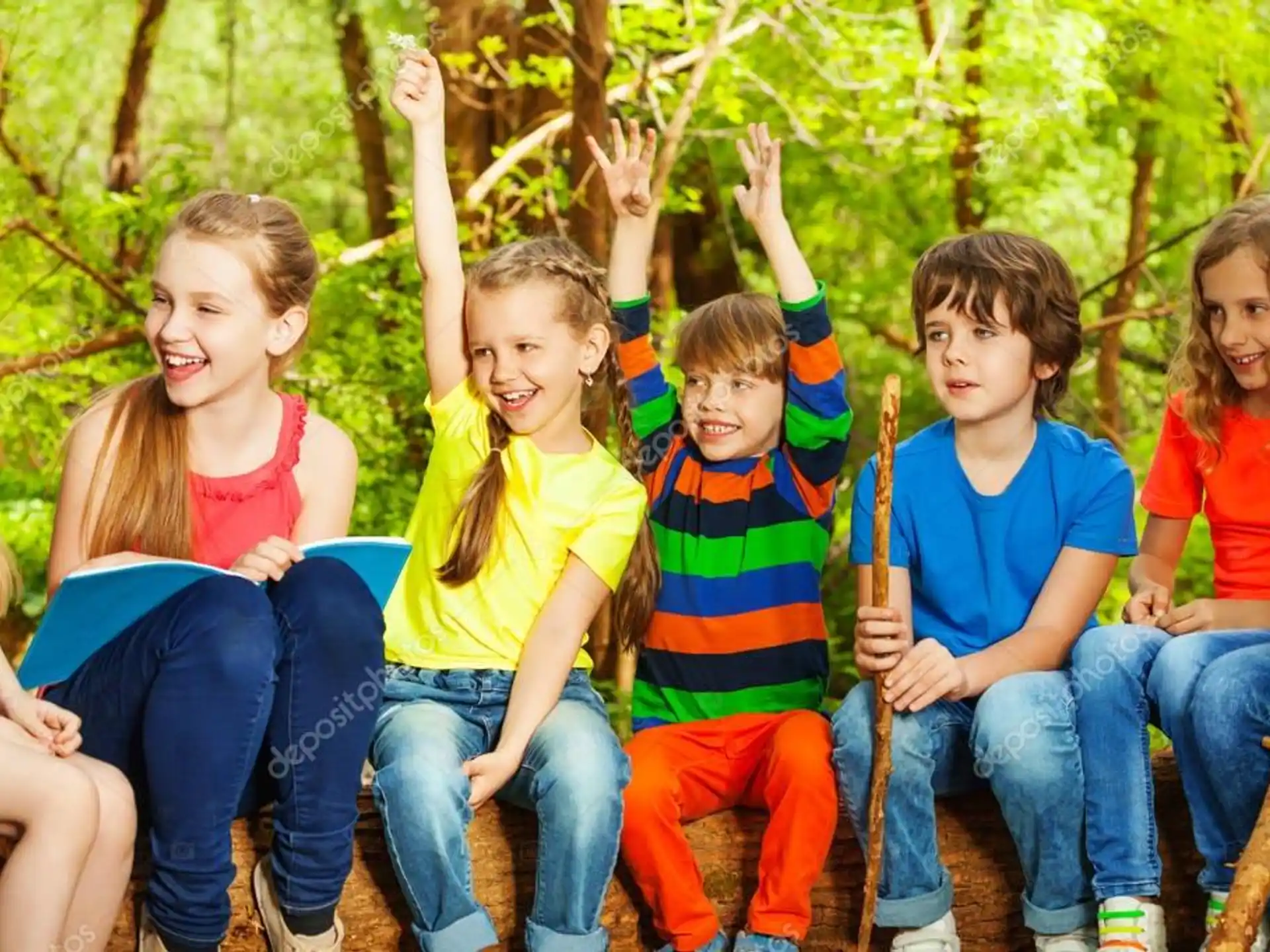 a group of children sitting on a bench