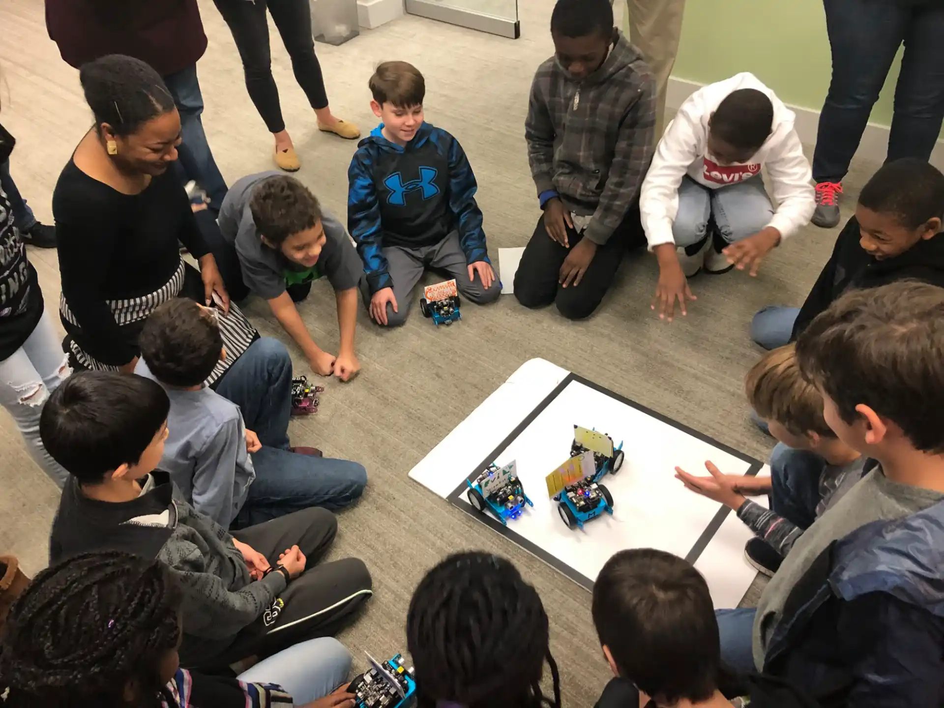 a group of people sitting around a table playing a board game