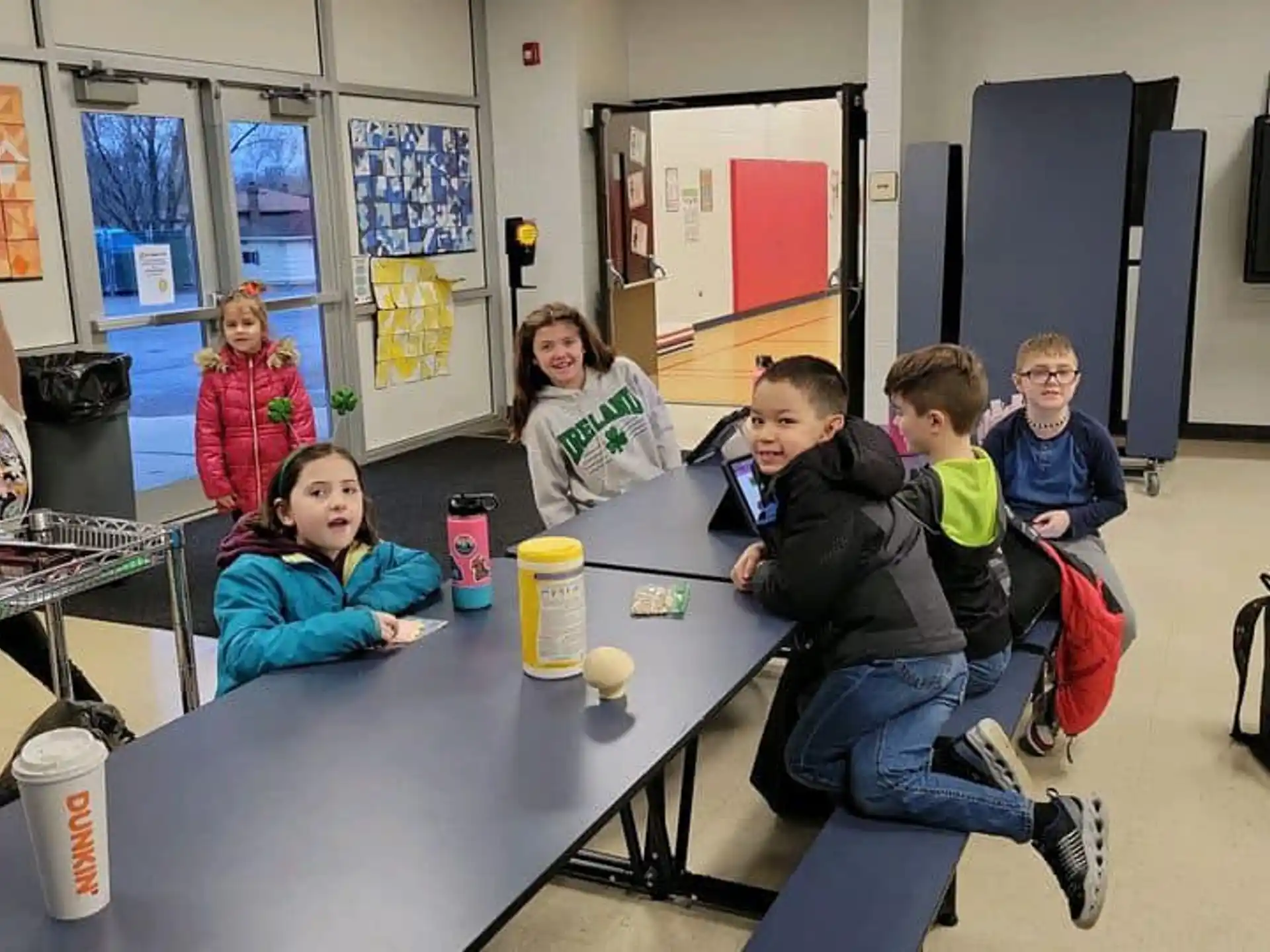 a group of people sitting at a table with drinks