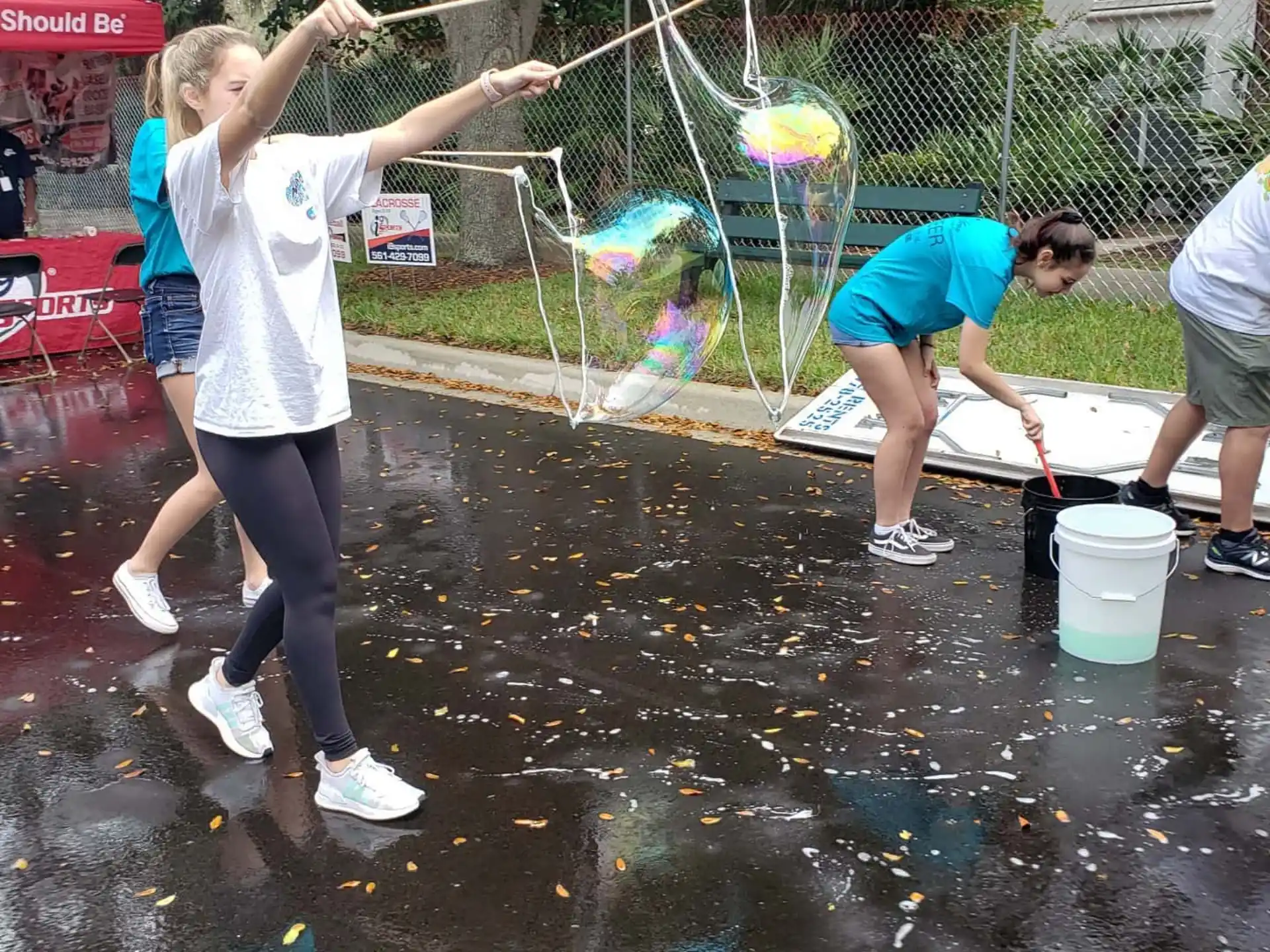 a group of people playing in a flooded area