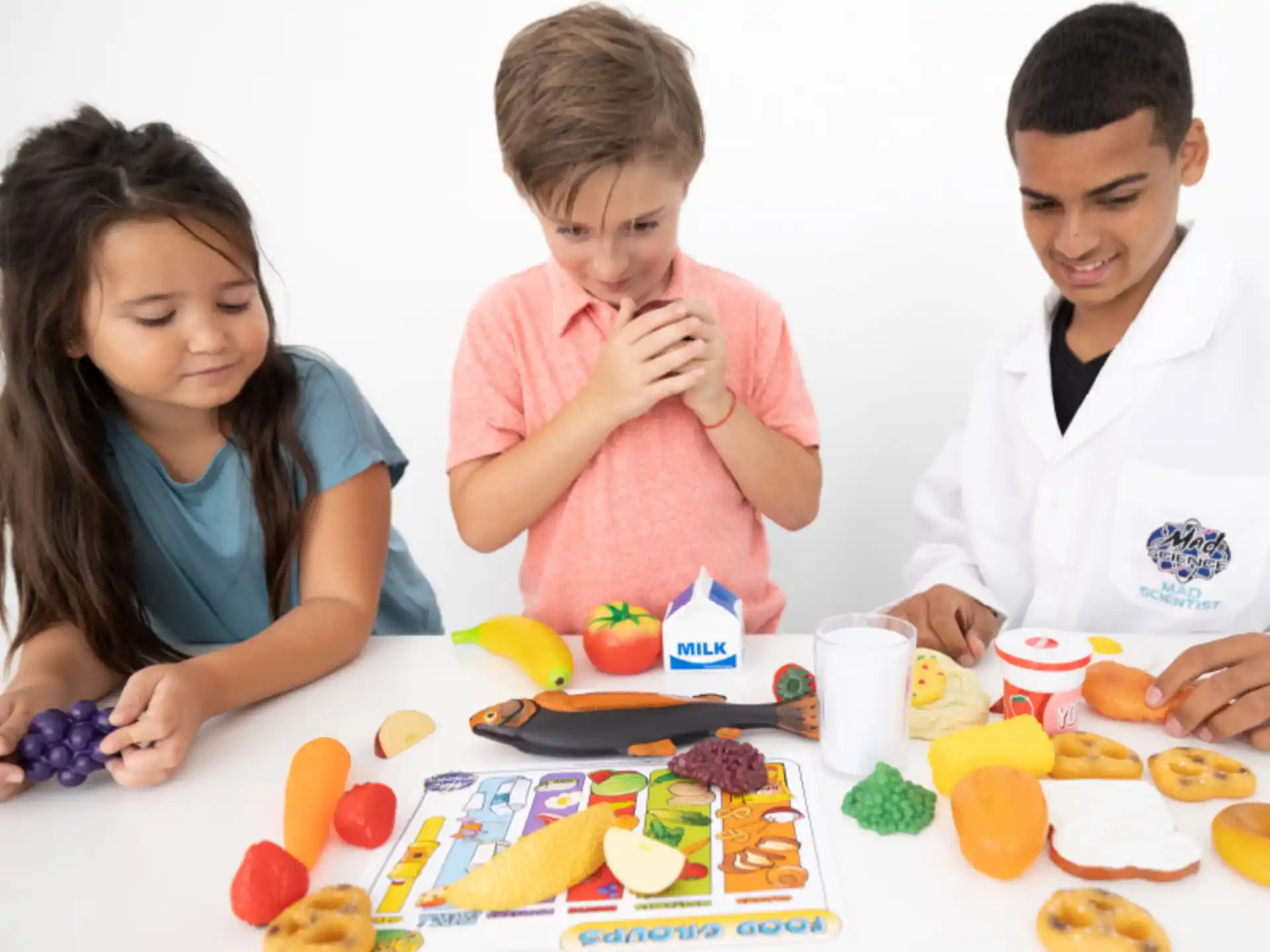 a group of people sitting at a table with food