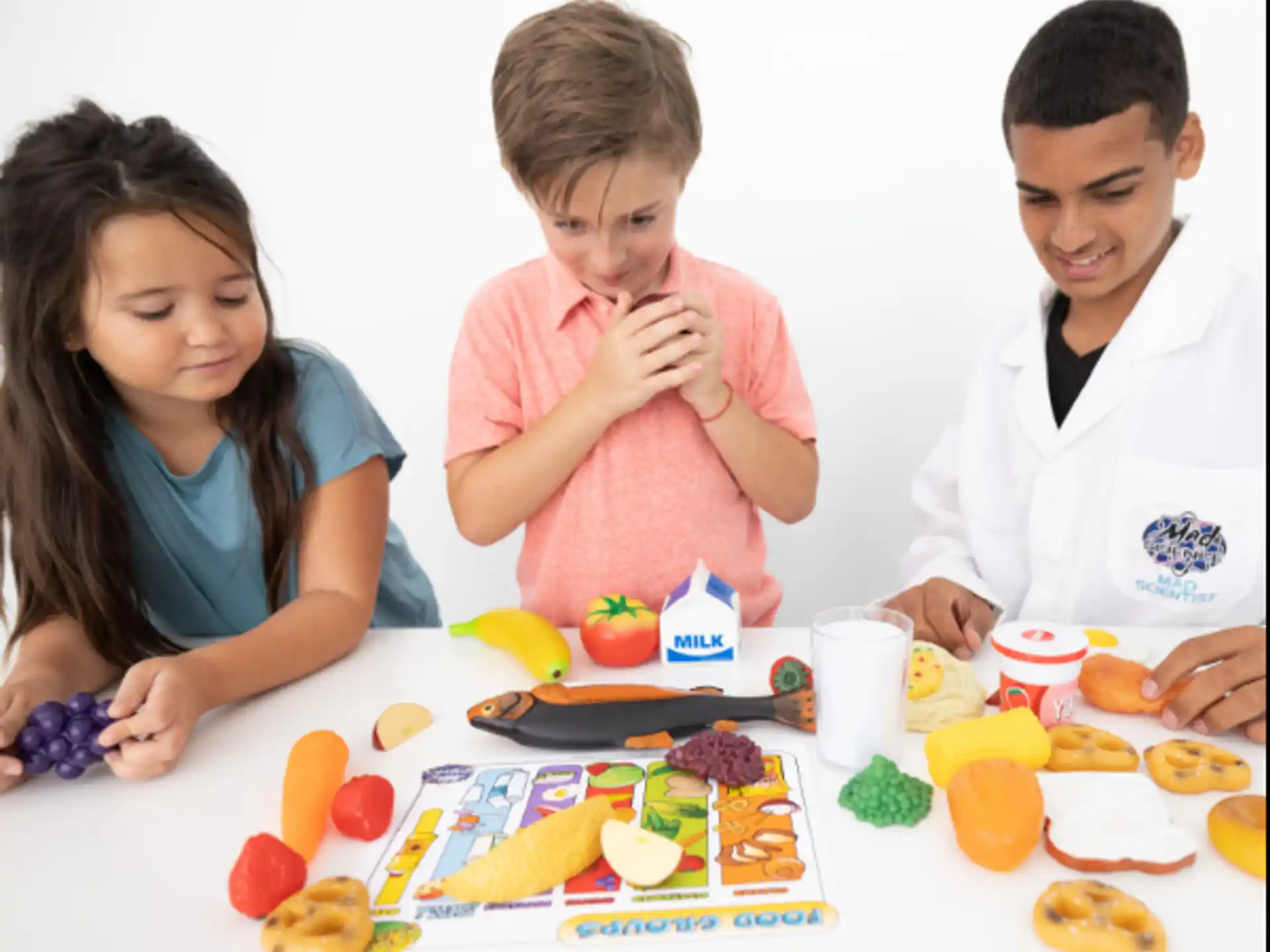 a group of people sitting at a table with food
