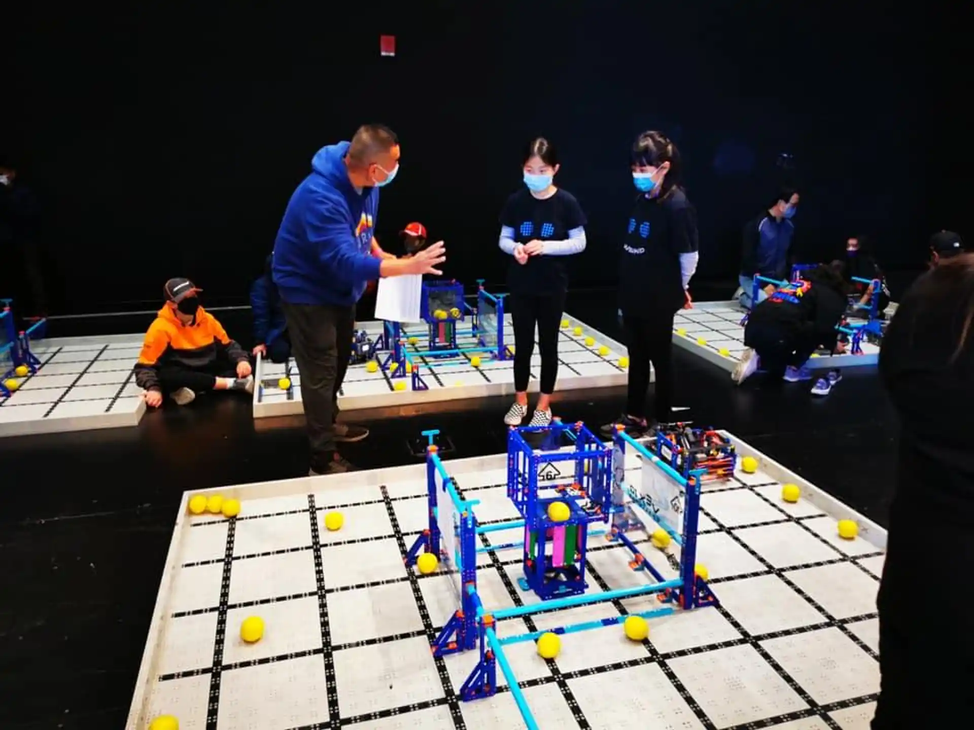 a group of people playing foosball