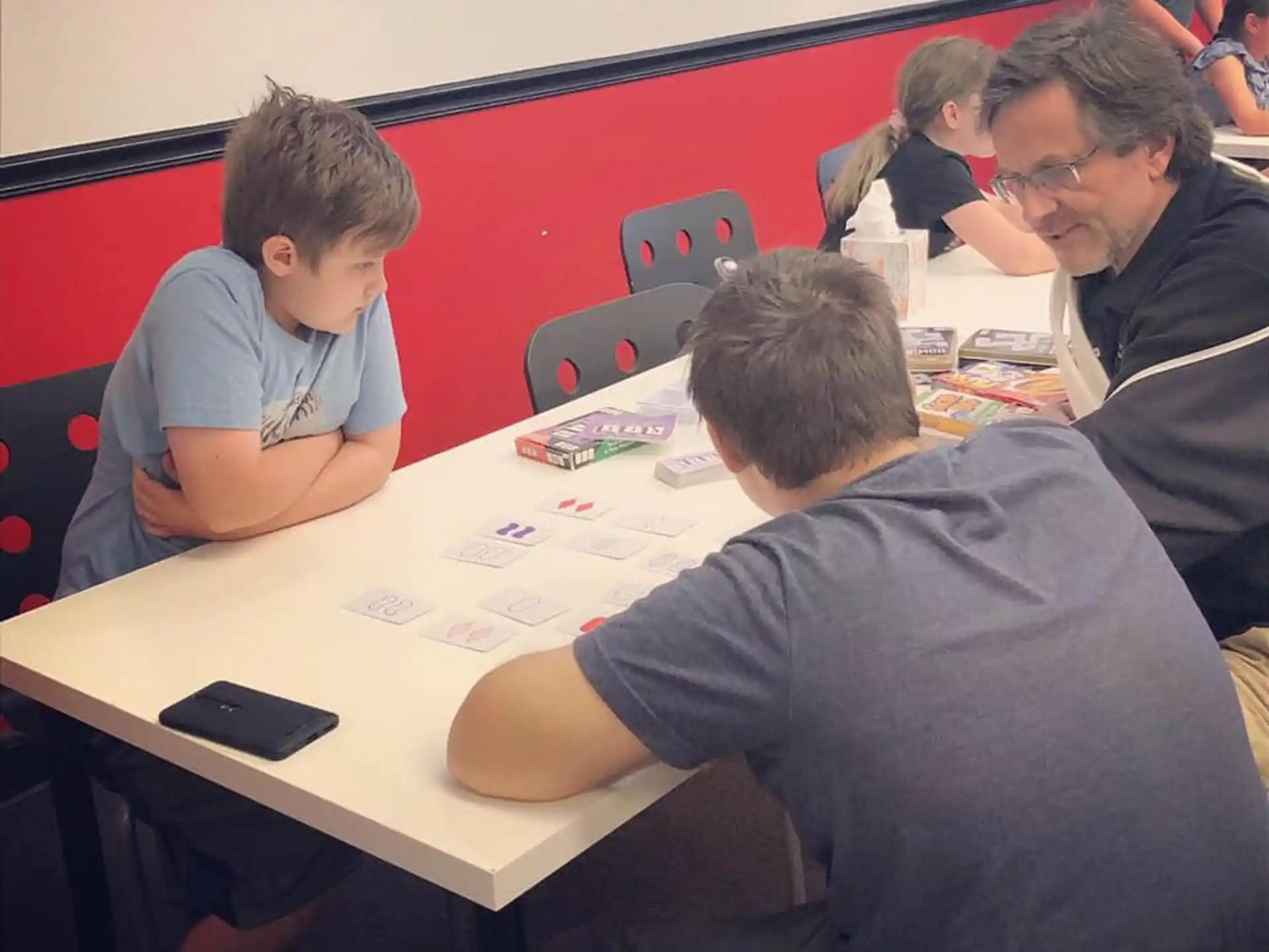 a group of people sitting around a table
