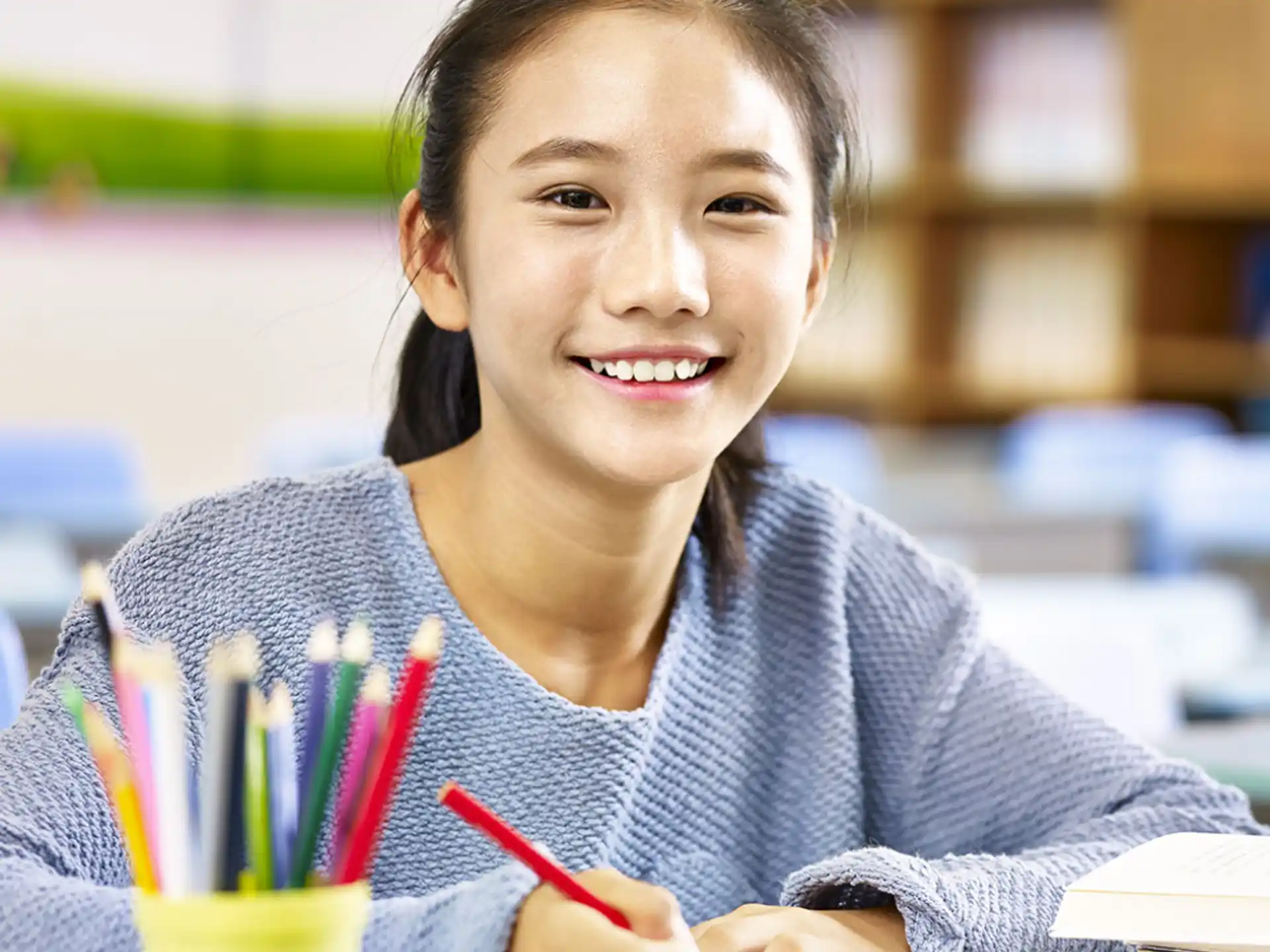 a young girl smiling