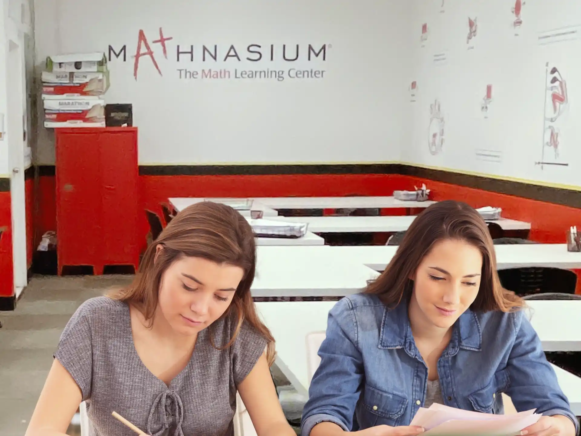a few women studying in a classroom