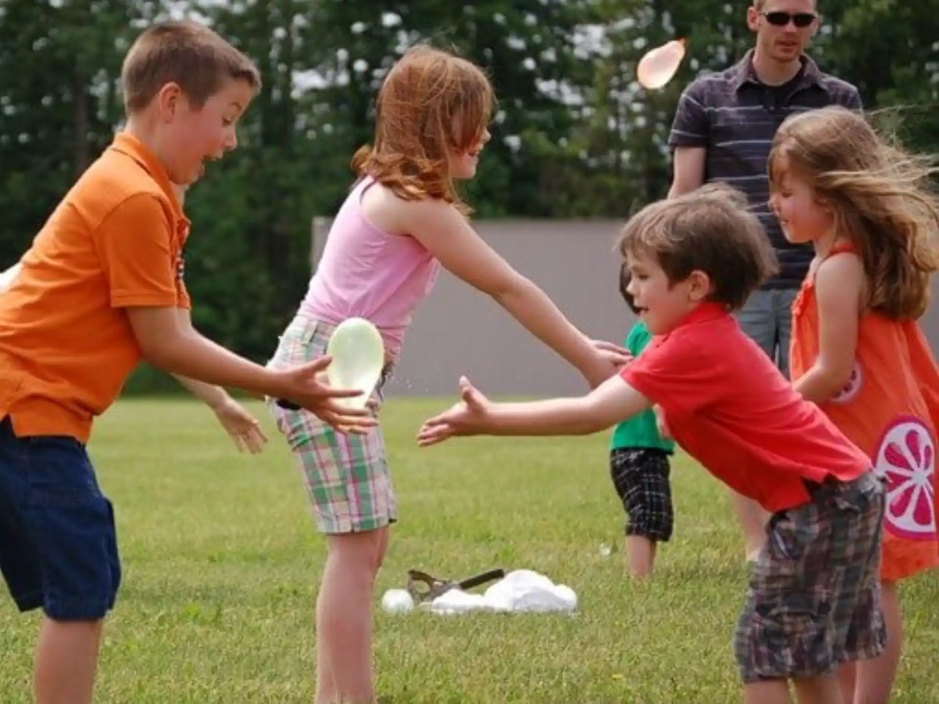 a group of people playing with a ball
