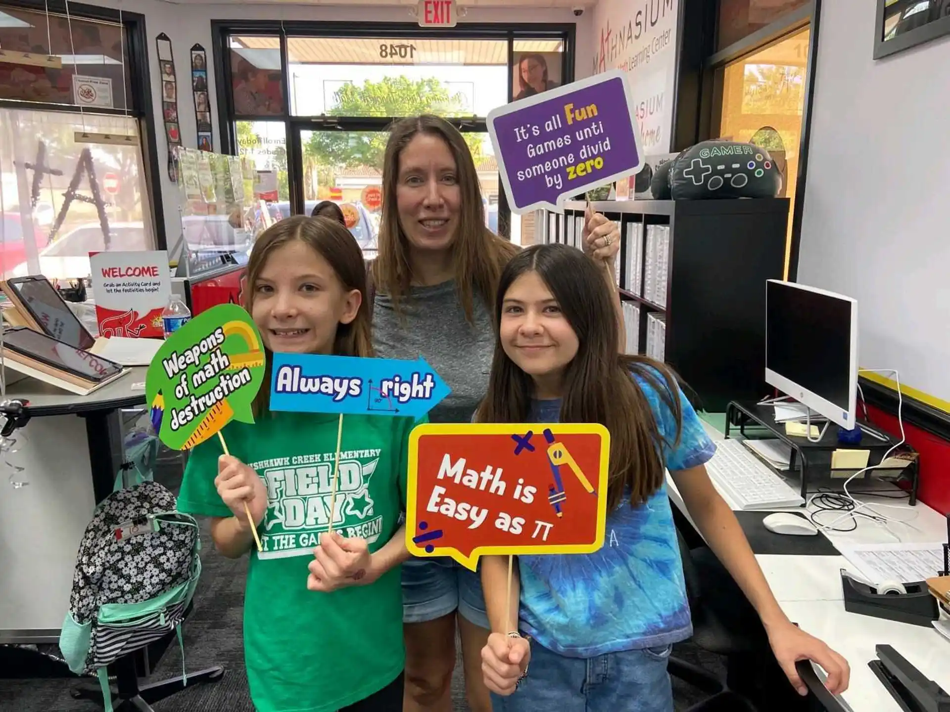 a group of girls holding signs