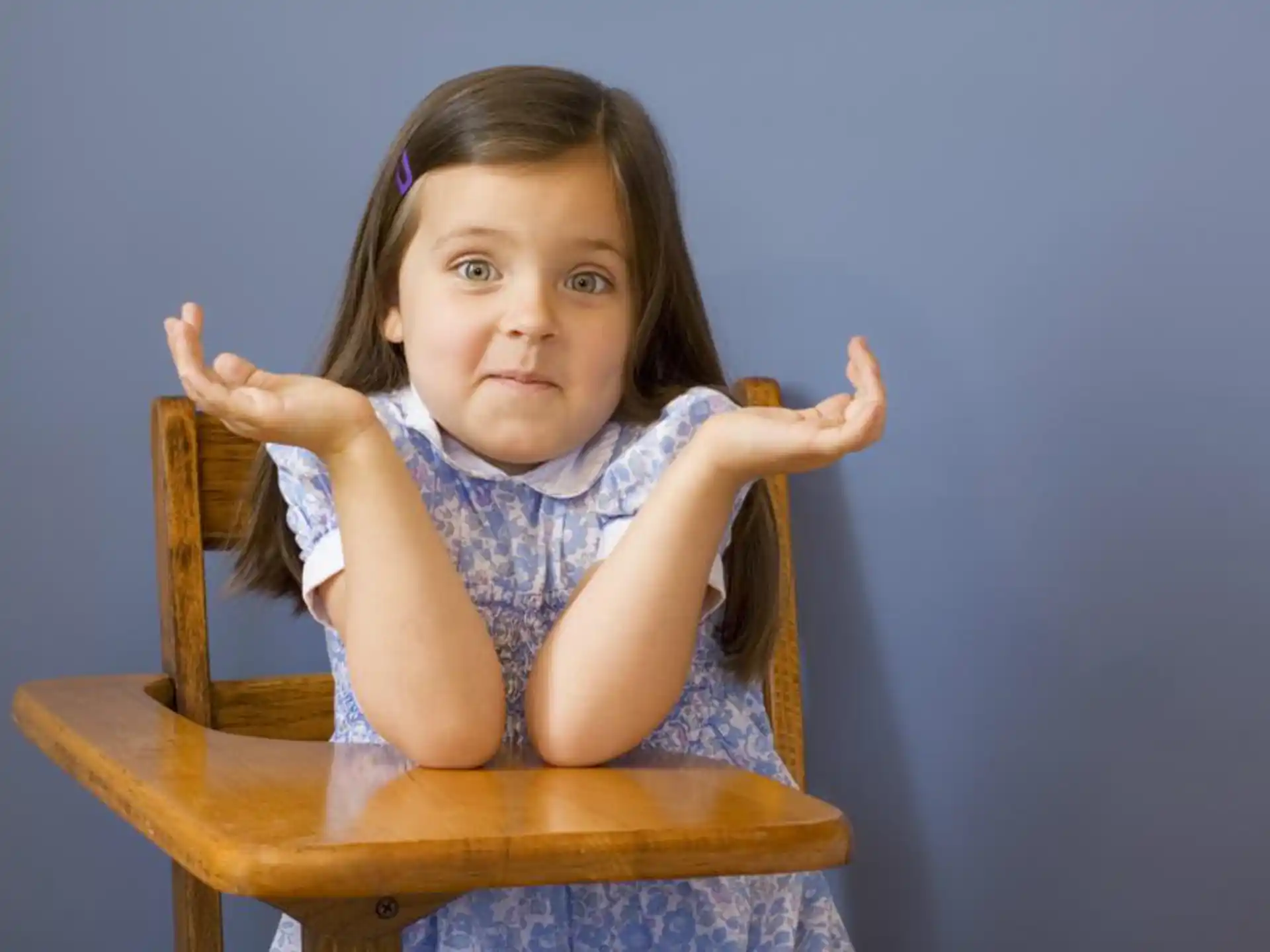 a girl sitting in a chair