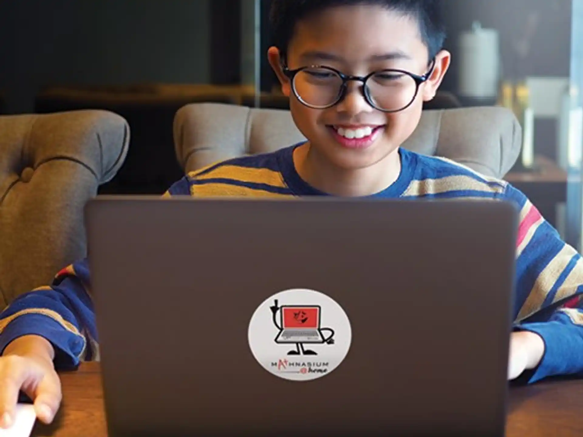 a boy using a laptop